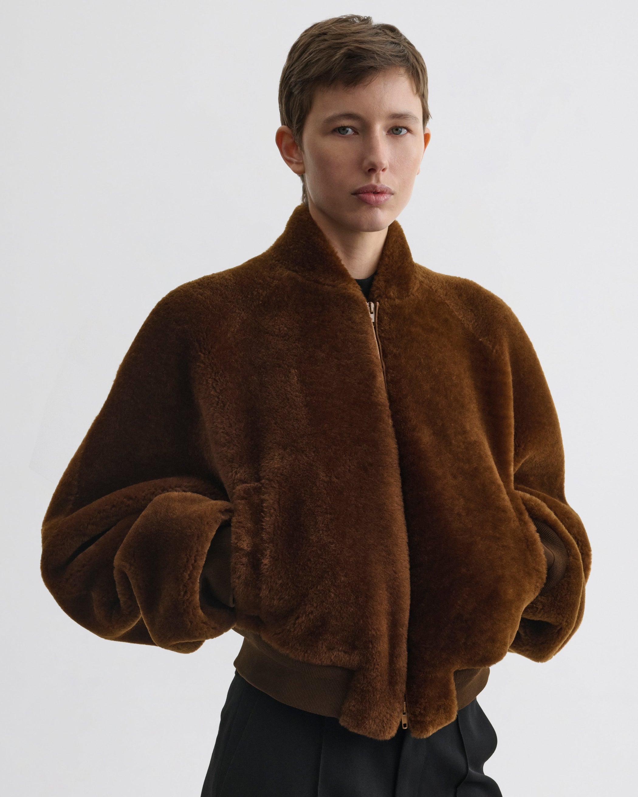 Front view of model wearing Super Soft Bomber Jacket in ginger shearling