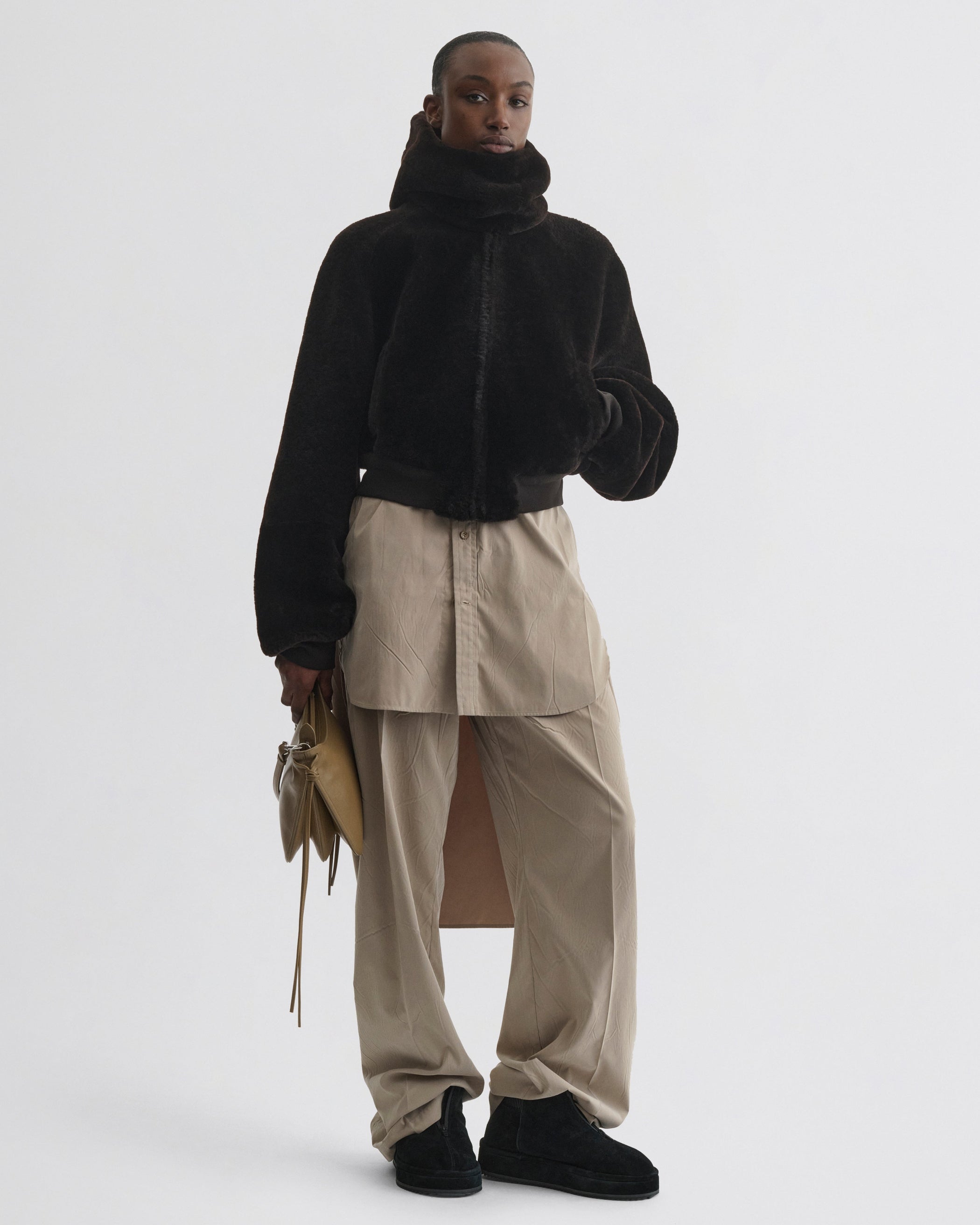 Front view of model wearing Super Soft Bomber Jacket in deep brown shearling