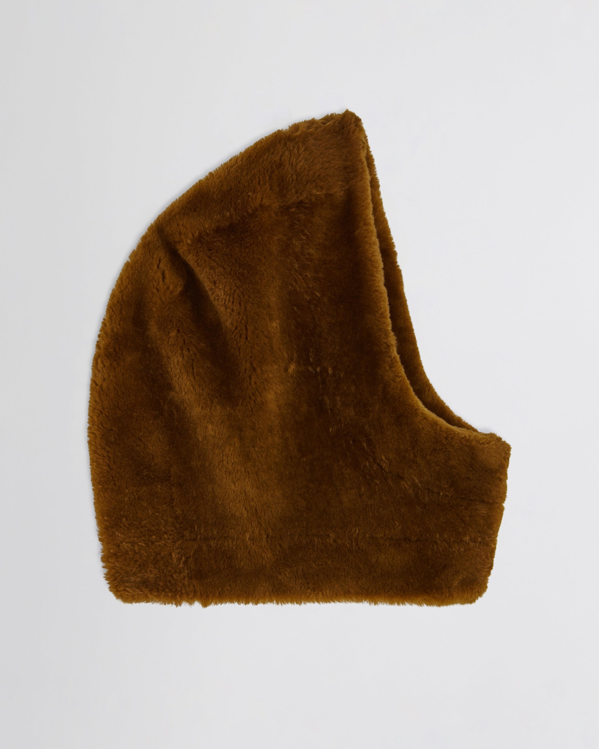 Flat side view of Capoosh in ginger shearling