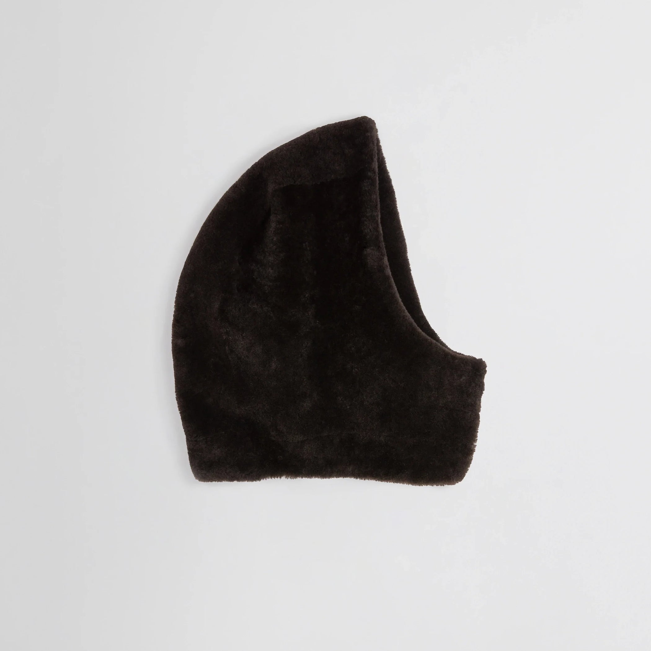 Flat side view of Capoosh in brown shearling