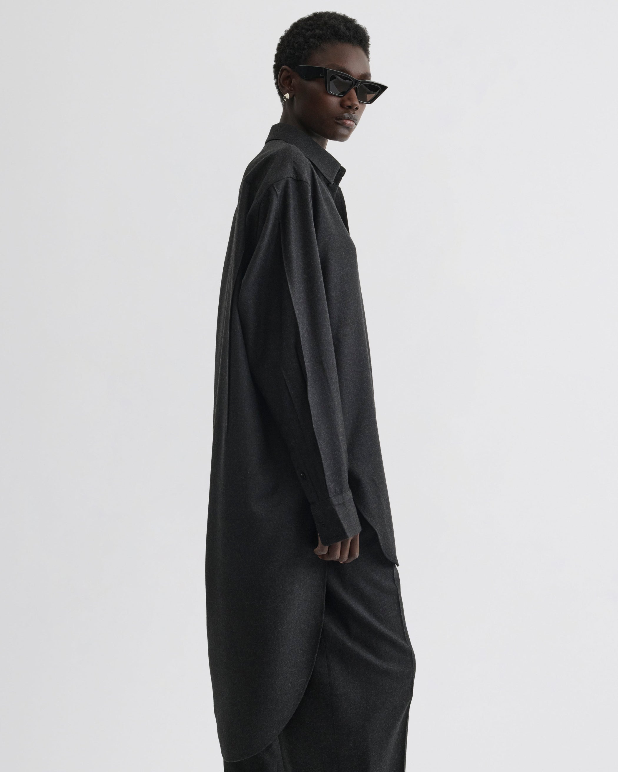 Side view of model wearing Elongated Shirt in charcoal wool
