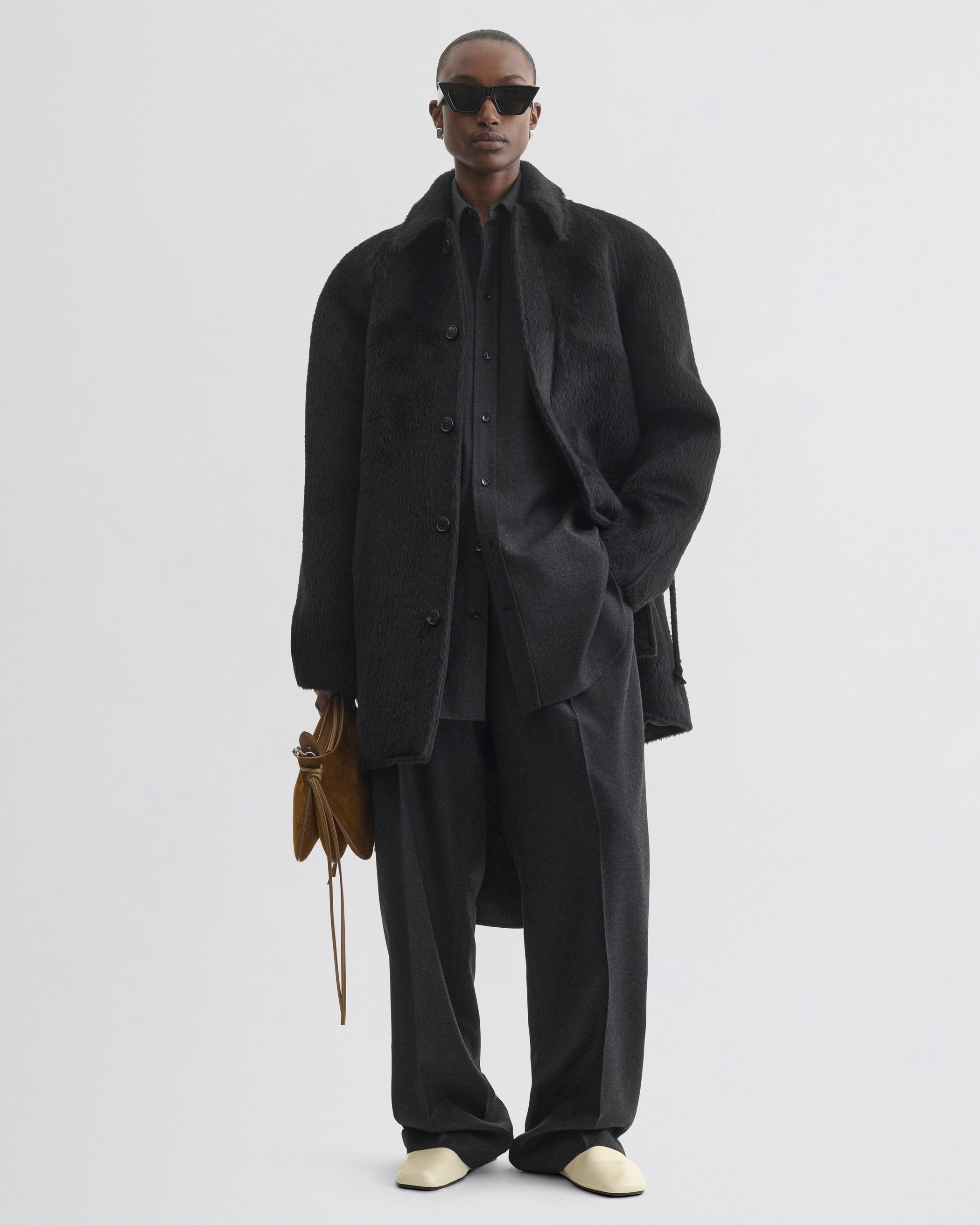Front view of model wearing Cropped Car Coat in black alpaca wool