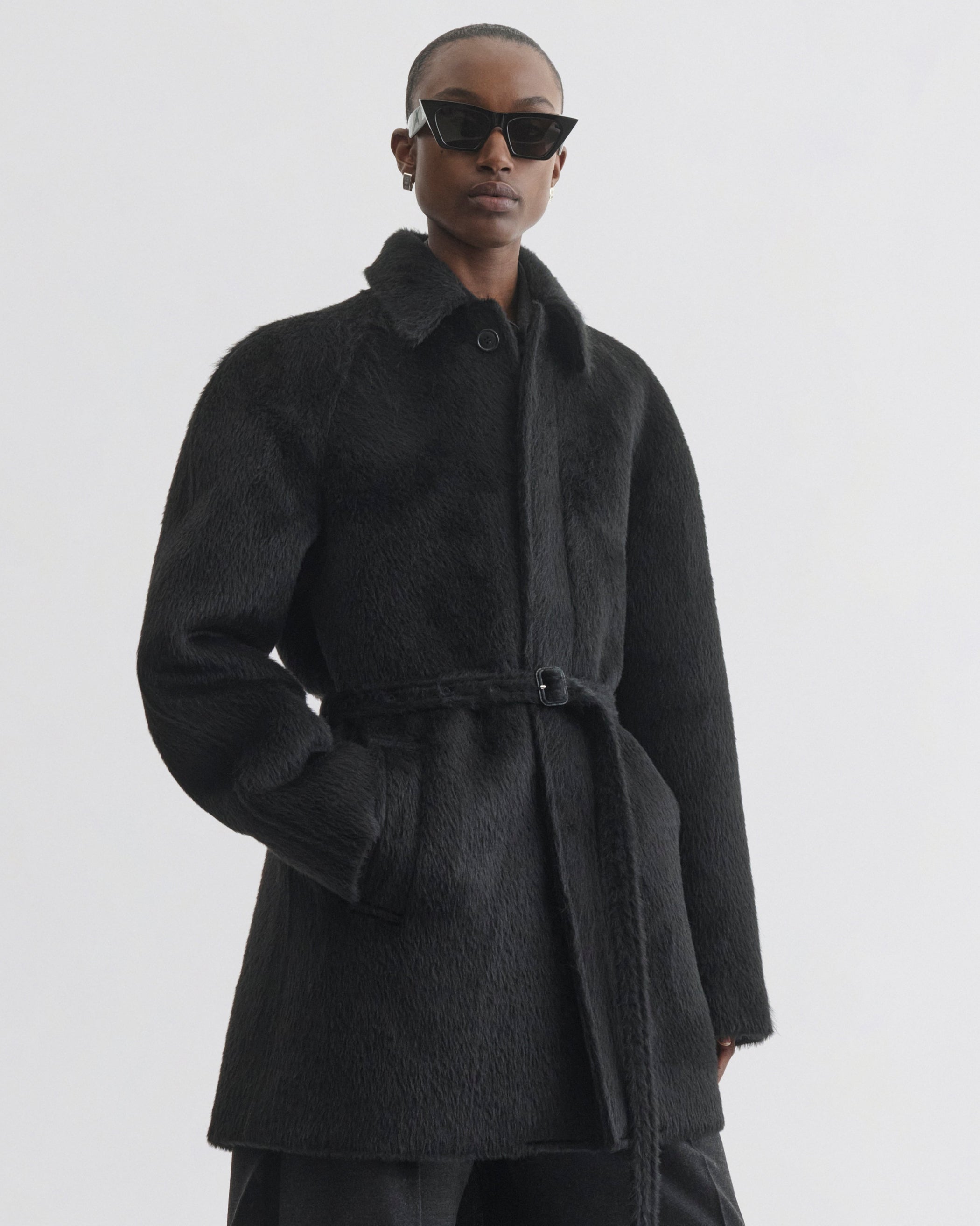 Front view of model wearing Cropped Car Coat in black alpaca wool