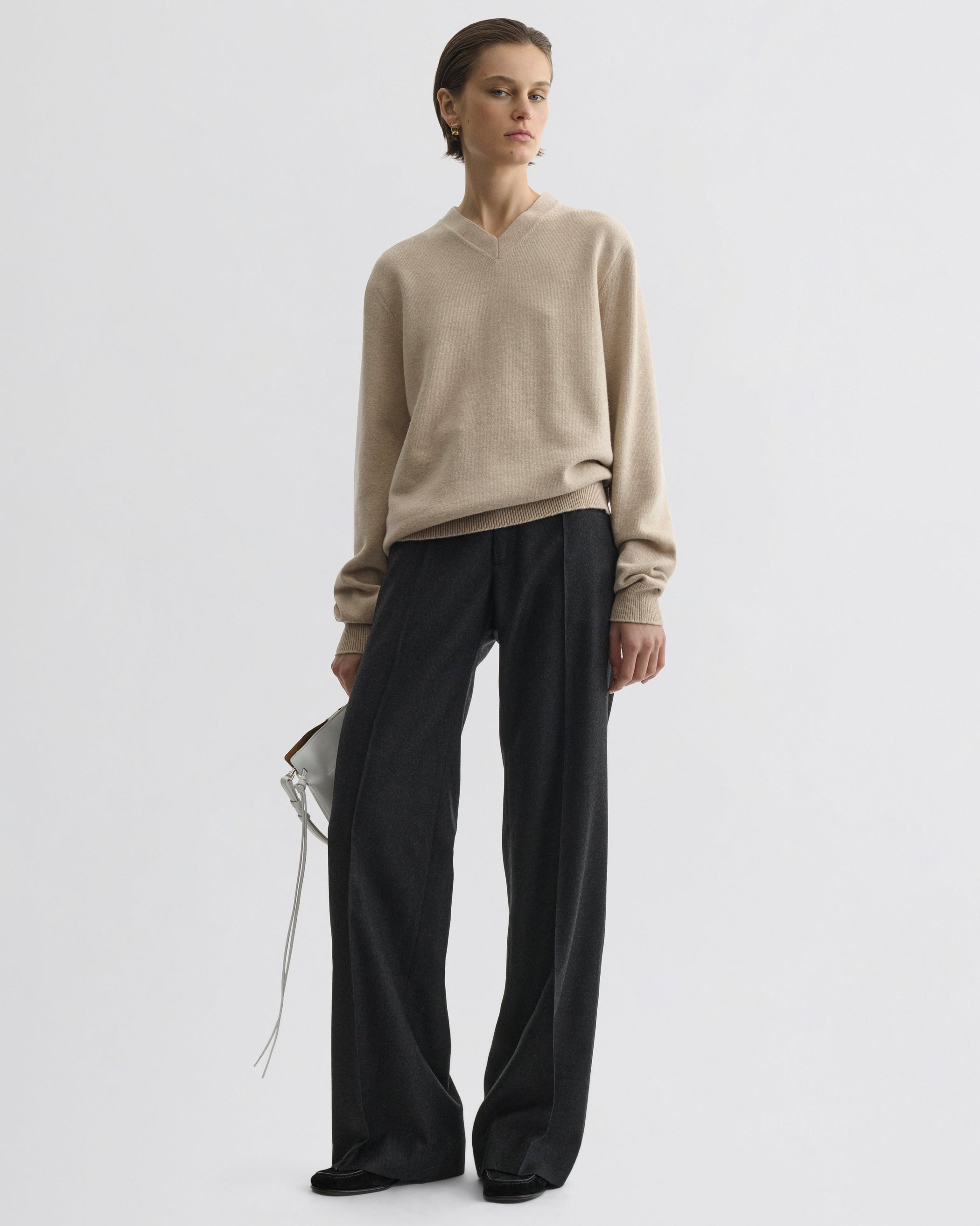 Front view of model wearing Boyish Tailored Trousers in charcoal wool