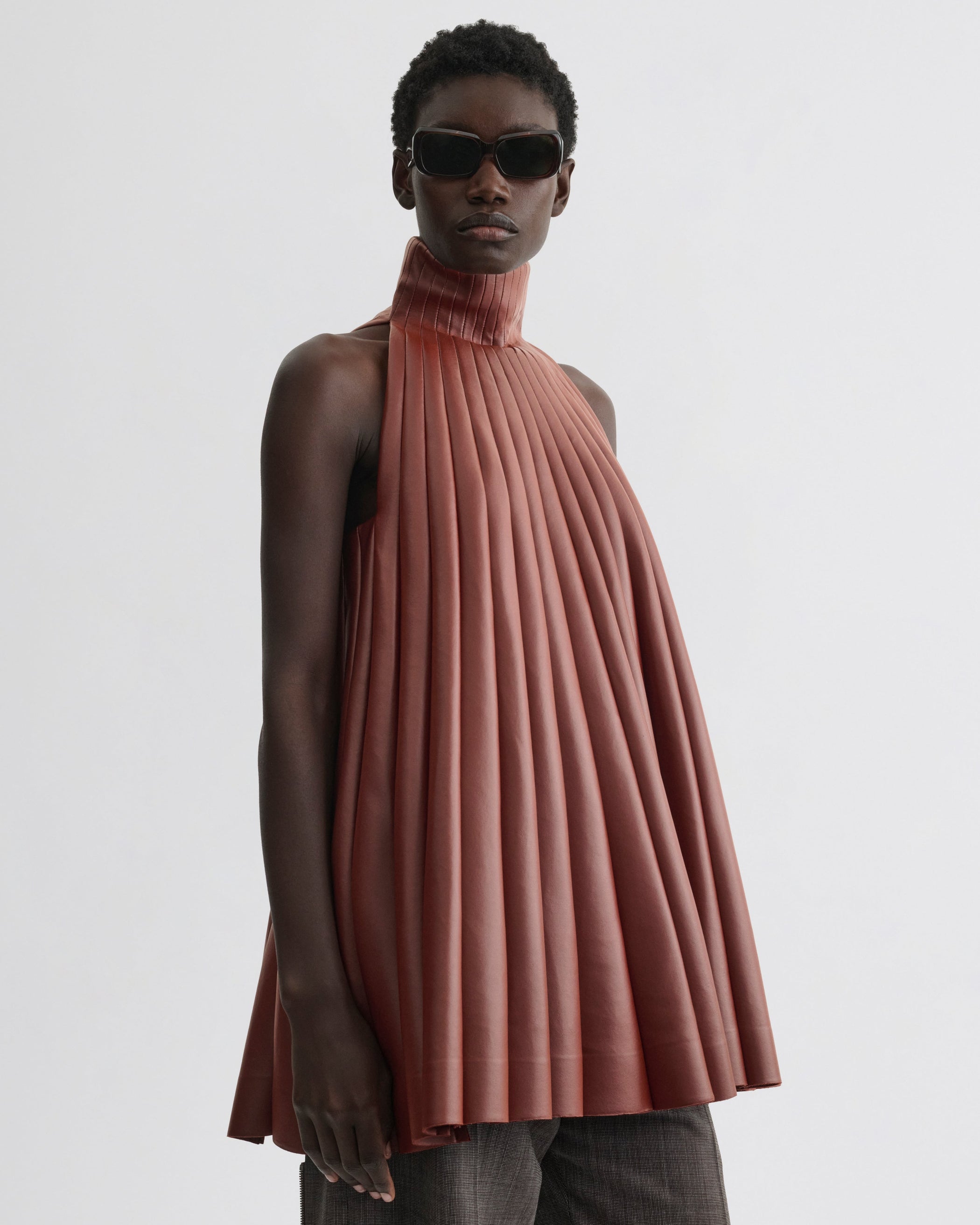 Front view of Accordion Top in brick bonded jersey