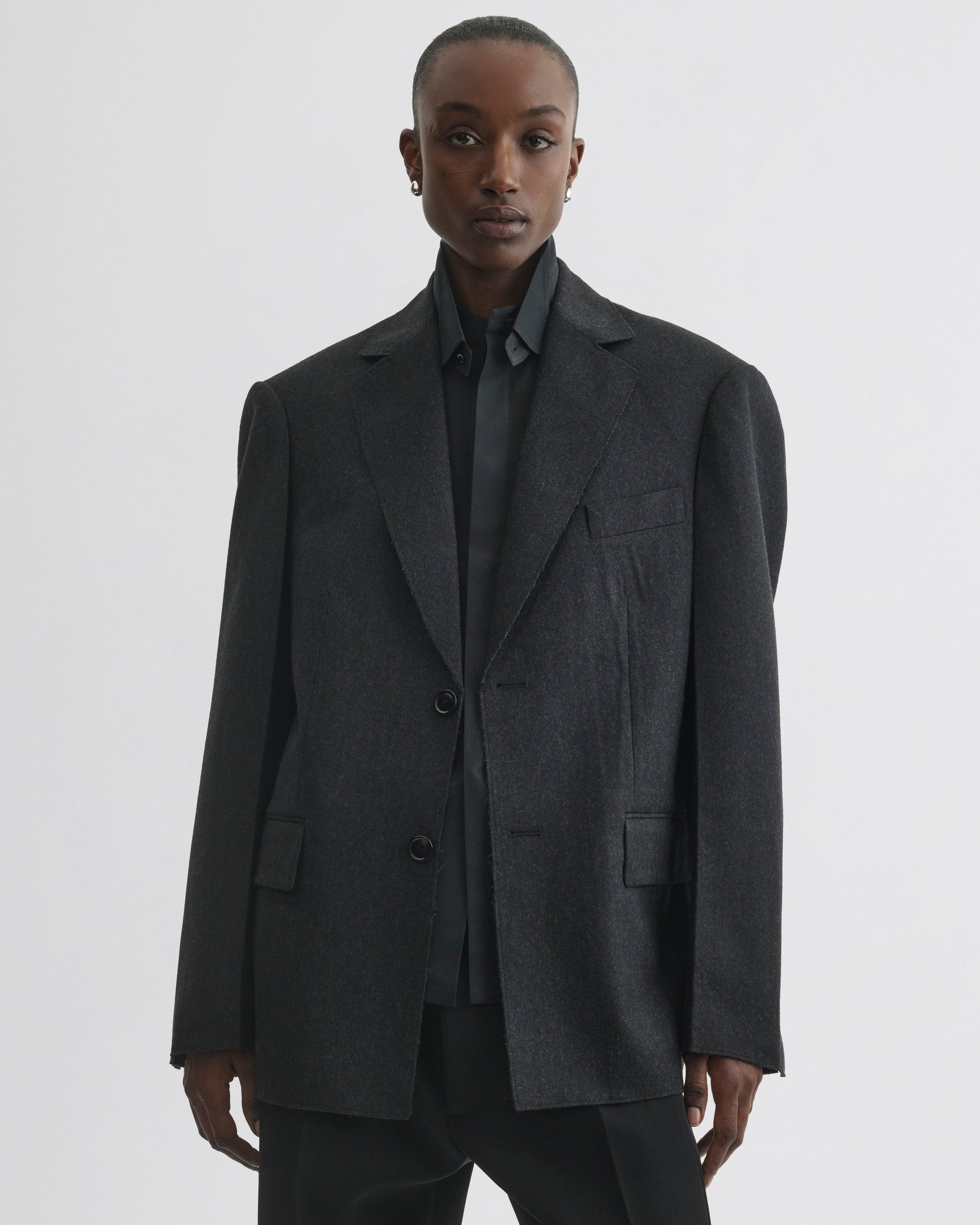 Front view of model wearing Tuxedo Jacket in anthracite wool