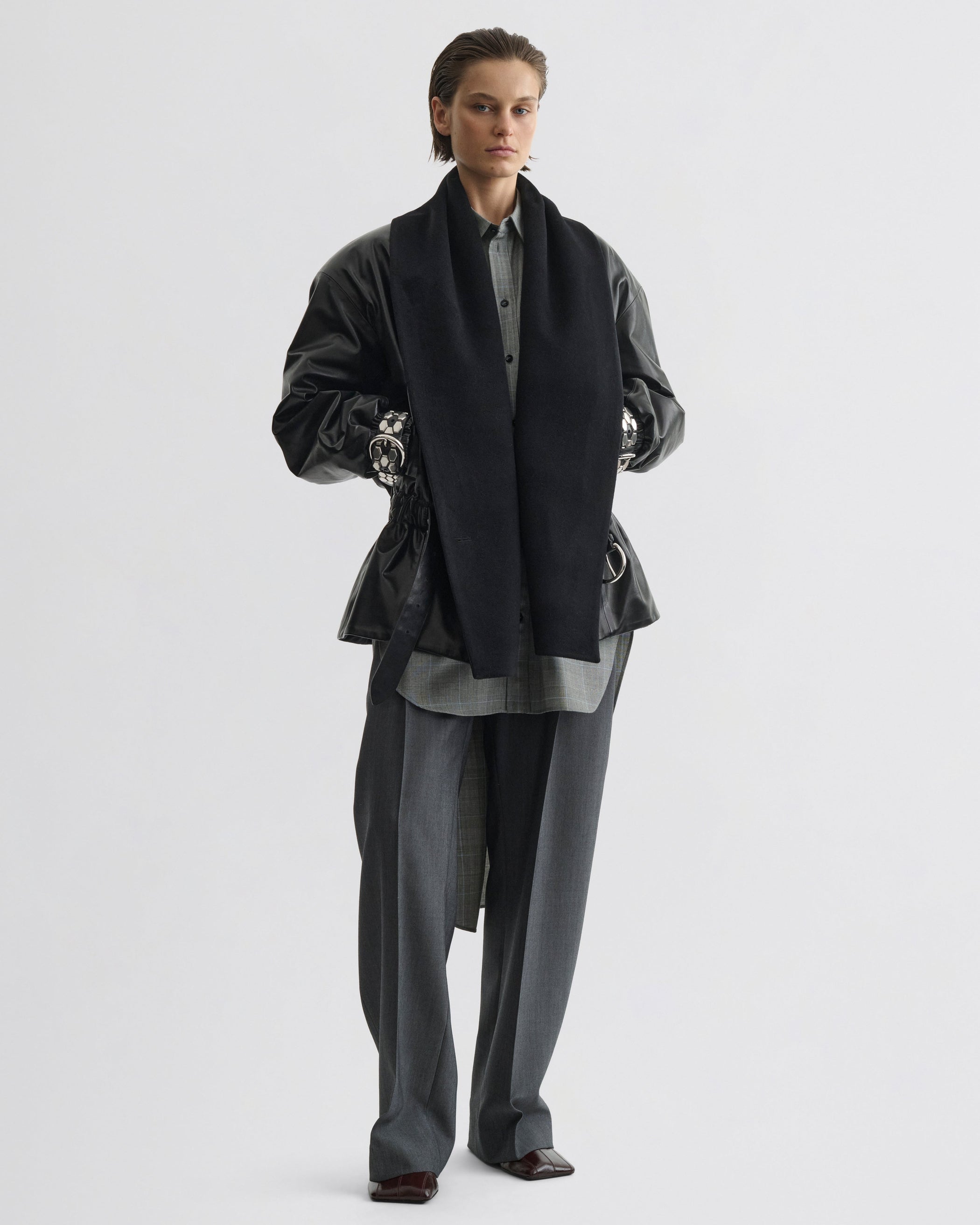 Front view of model wearing Stud Jacket in black leather
