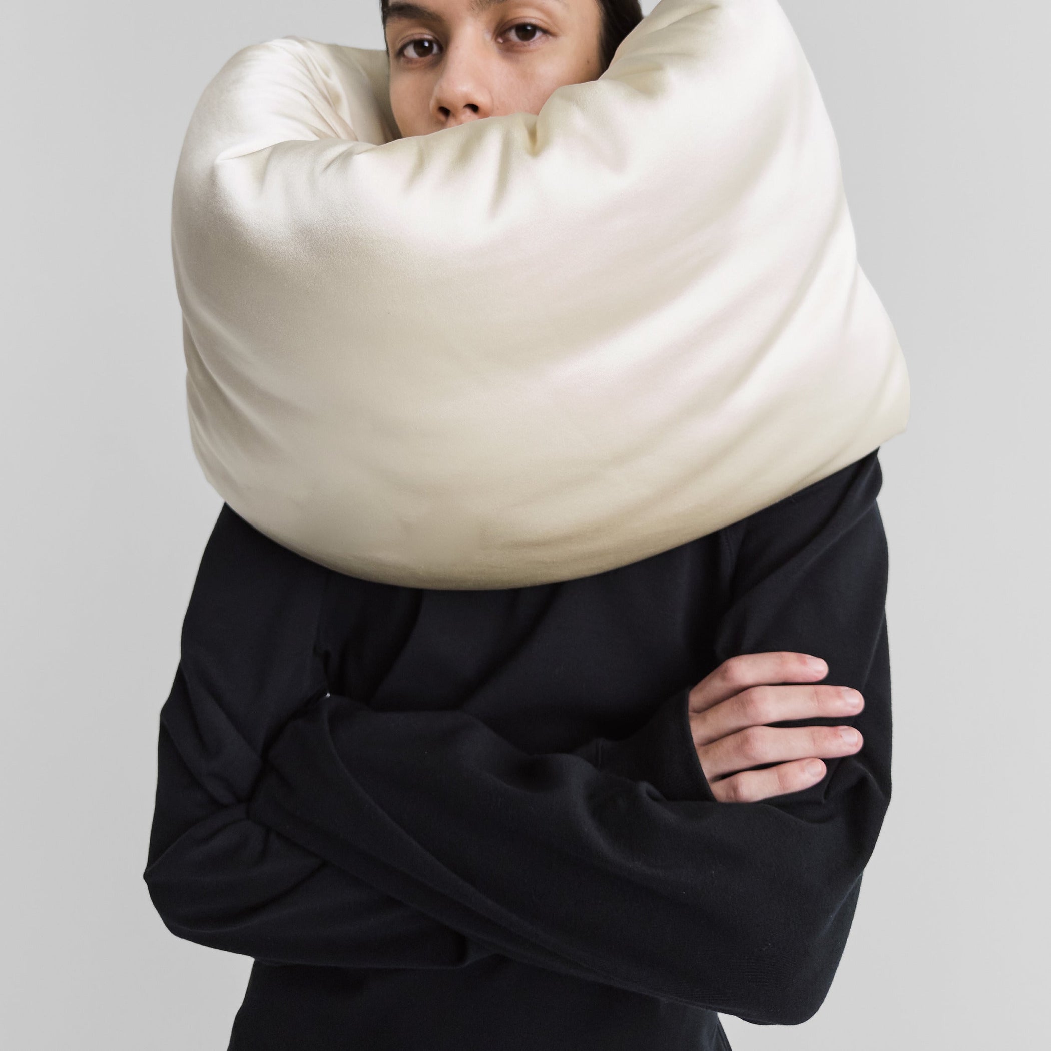Front view of model wearing PILLOW SCARF in cream silk satin