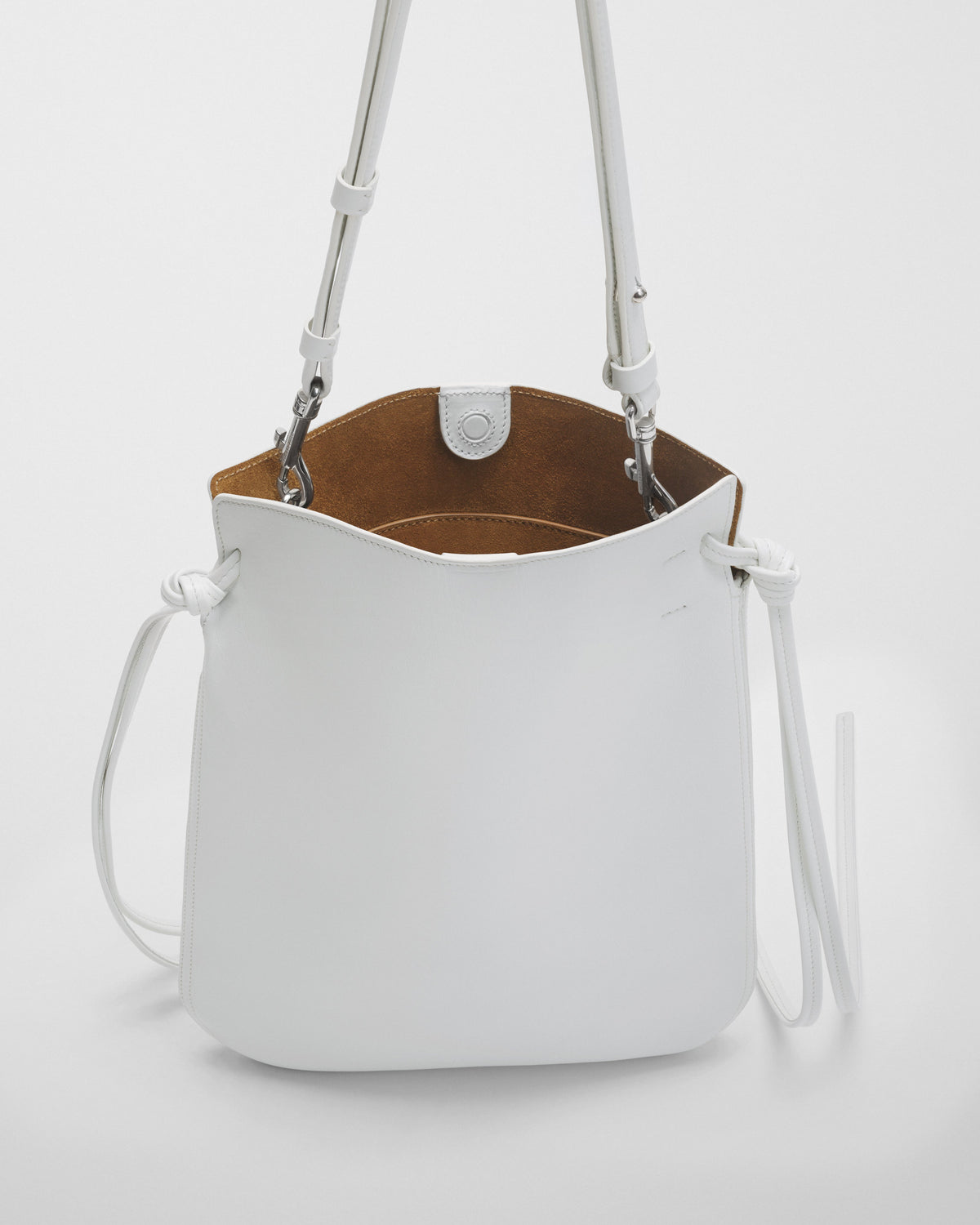 Detail view of GIG POUCH in white leather with silver