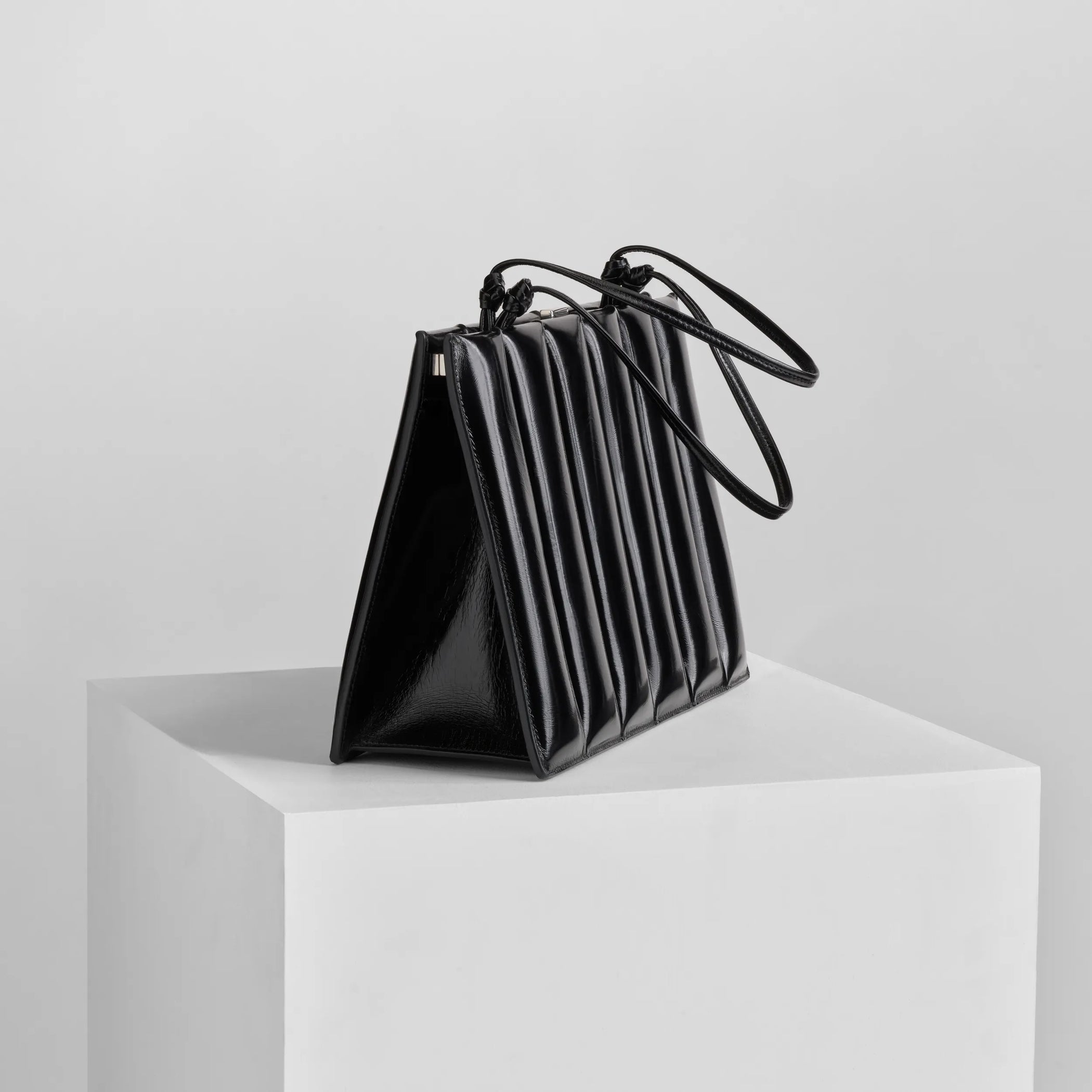 Angled view of drive bag in black leather.