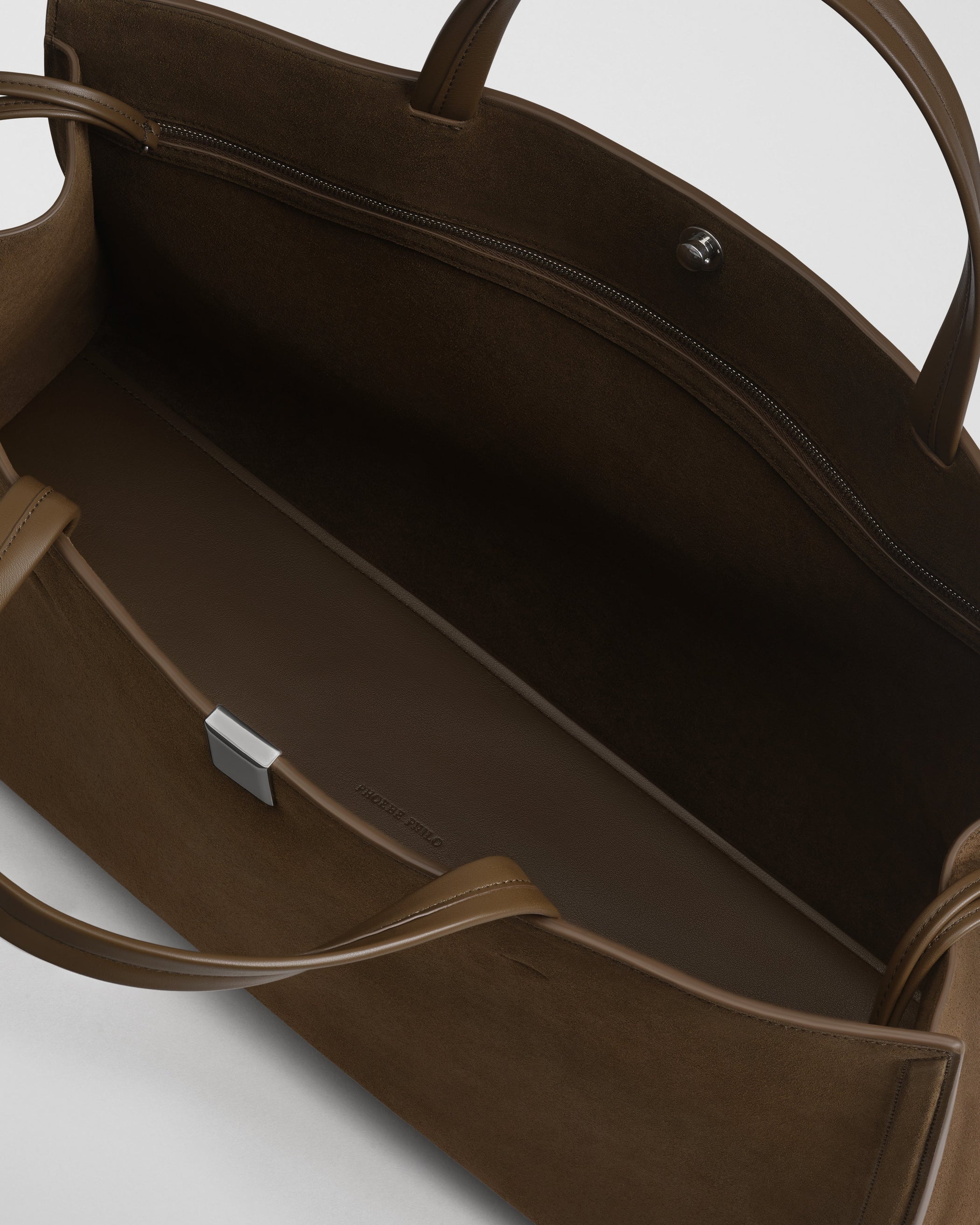 Close up detail view of medium kit cabas in khaki suede leather.