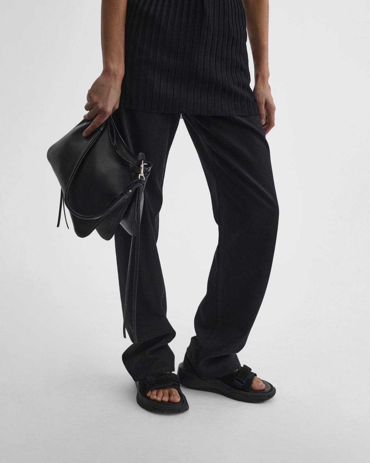 Front view of holding GIG BAG in black leather