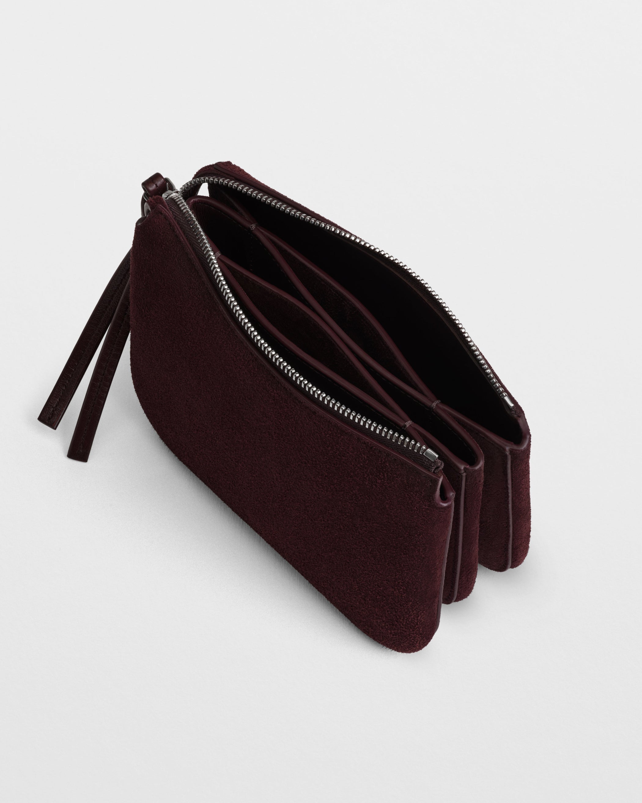 Close up detail view of POCKET GIG in oxblood suede leather