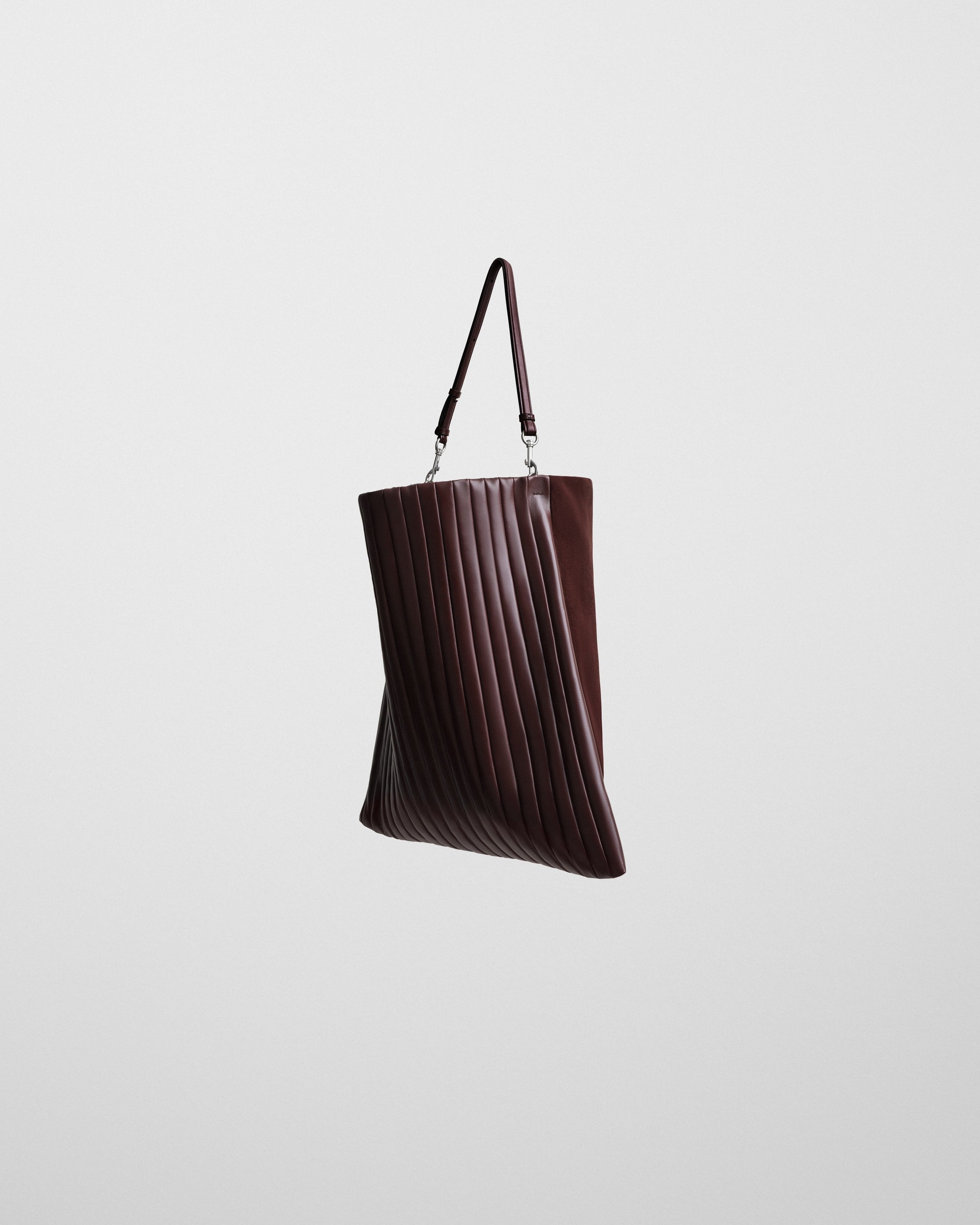 Side view of the ACCORDION BAG in oxblood leather