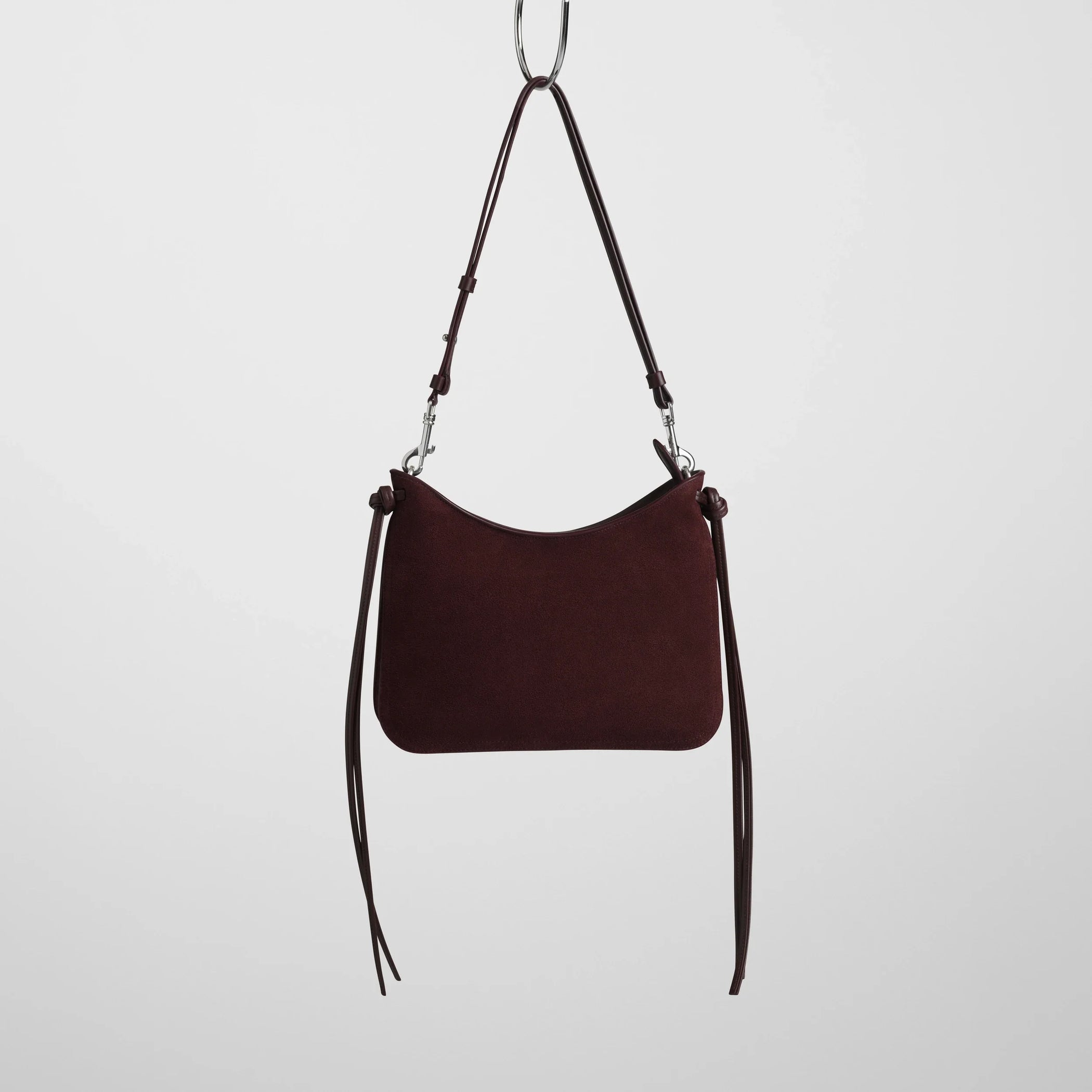 Front view of small gig bag in oxblood suede leather.