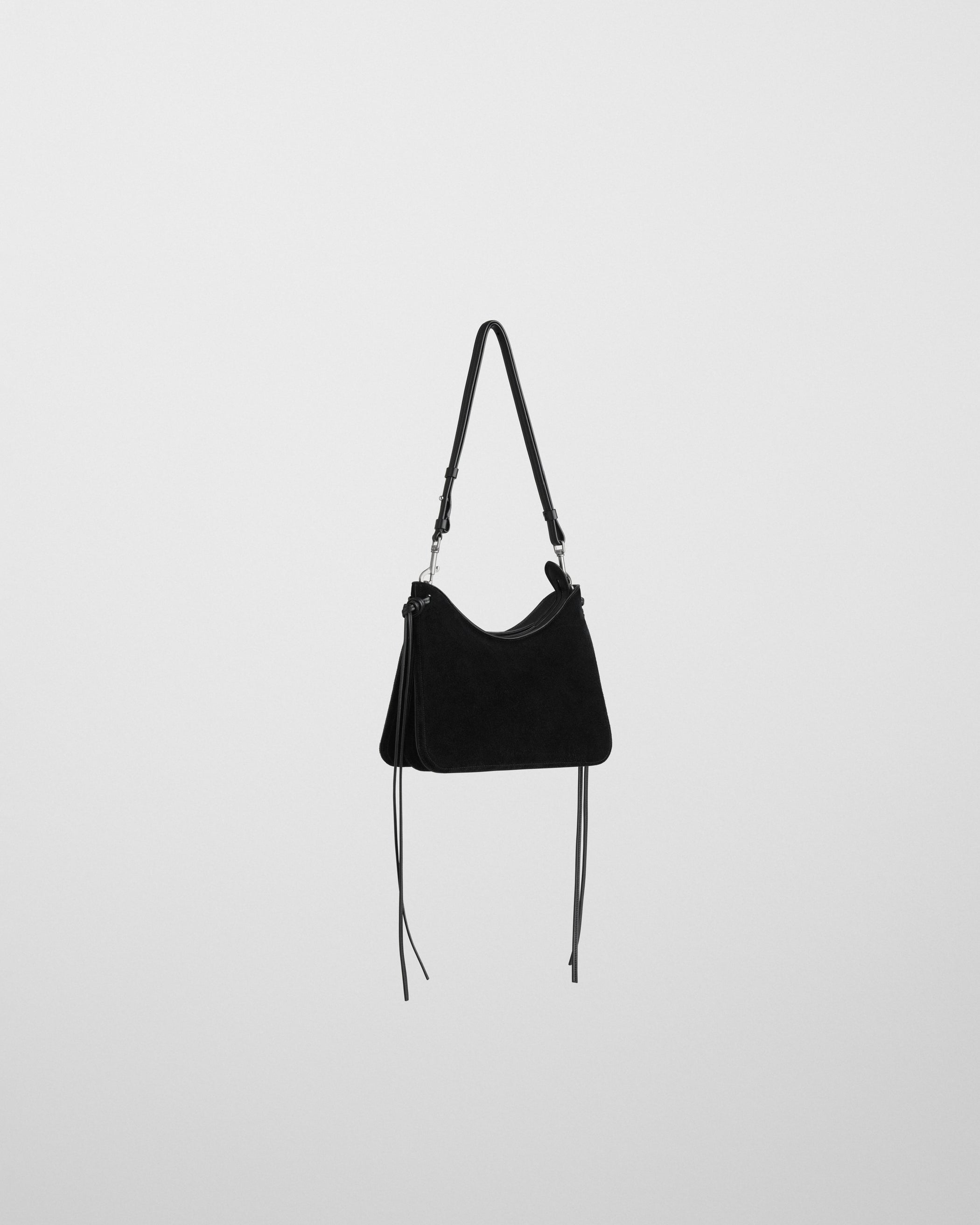 Angled front view of SMALL GIG BAG in black suede
