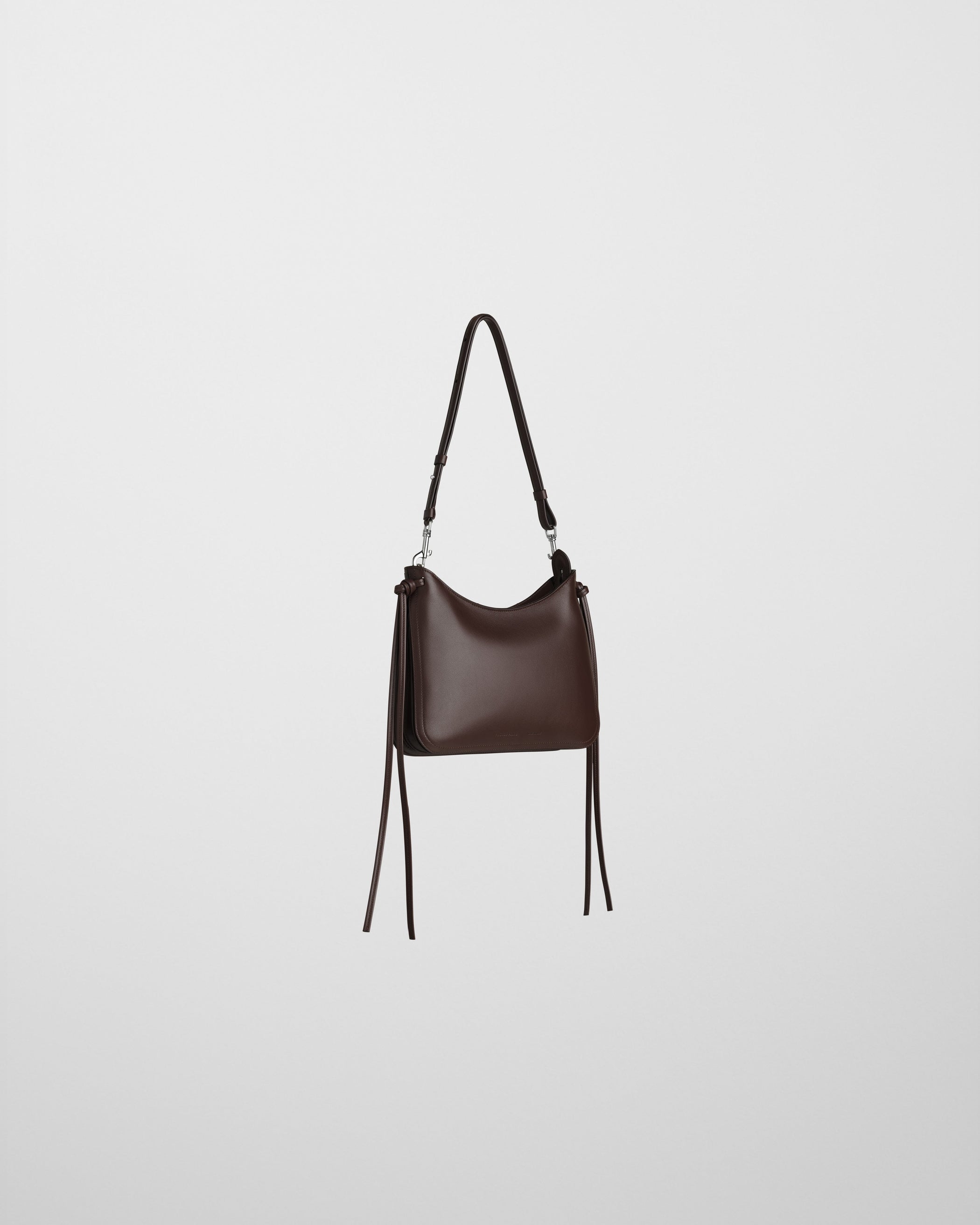 Angled front view of SMALL GIG BAG in cognac leather