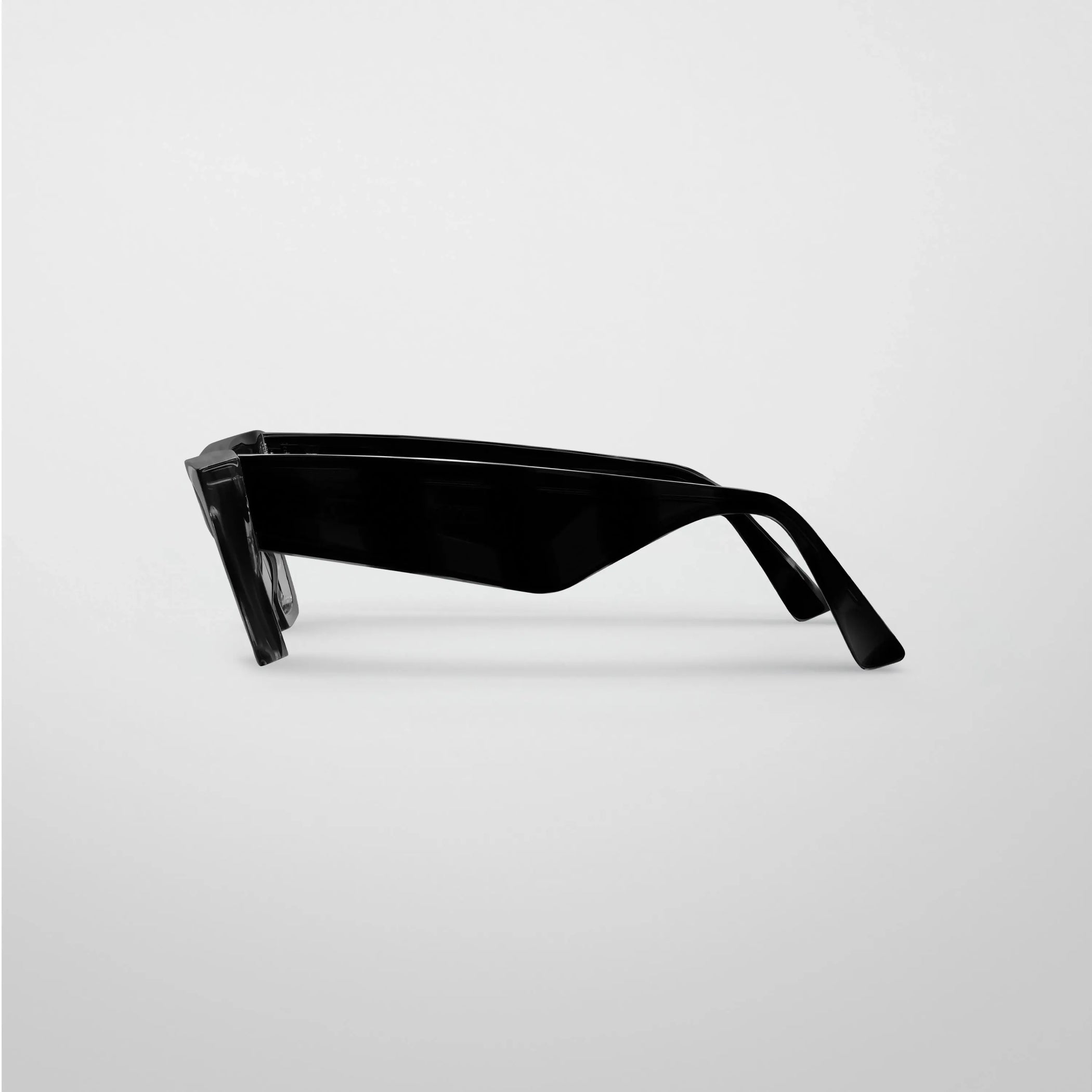Side view of peak sunglasses in black acetate.