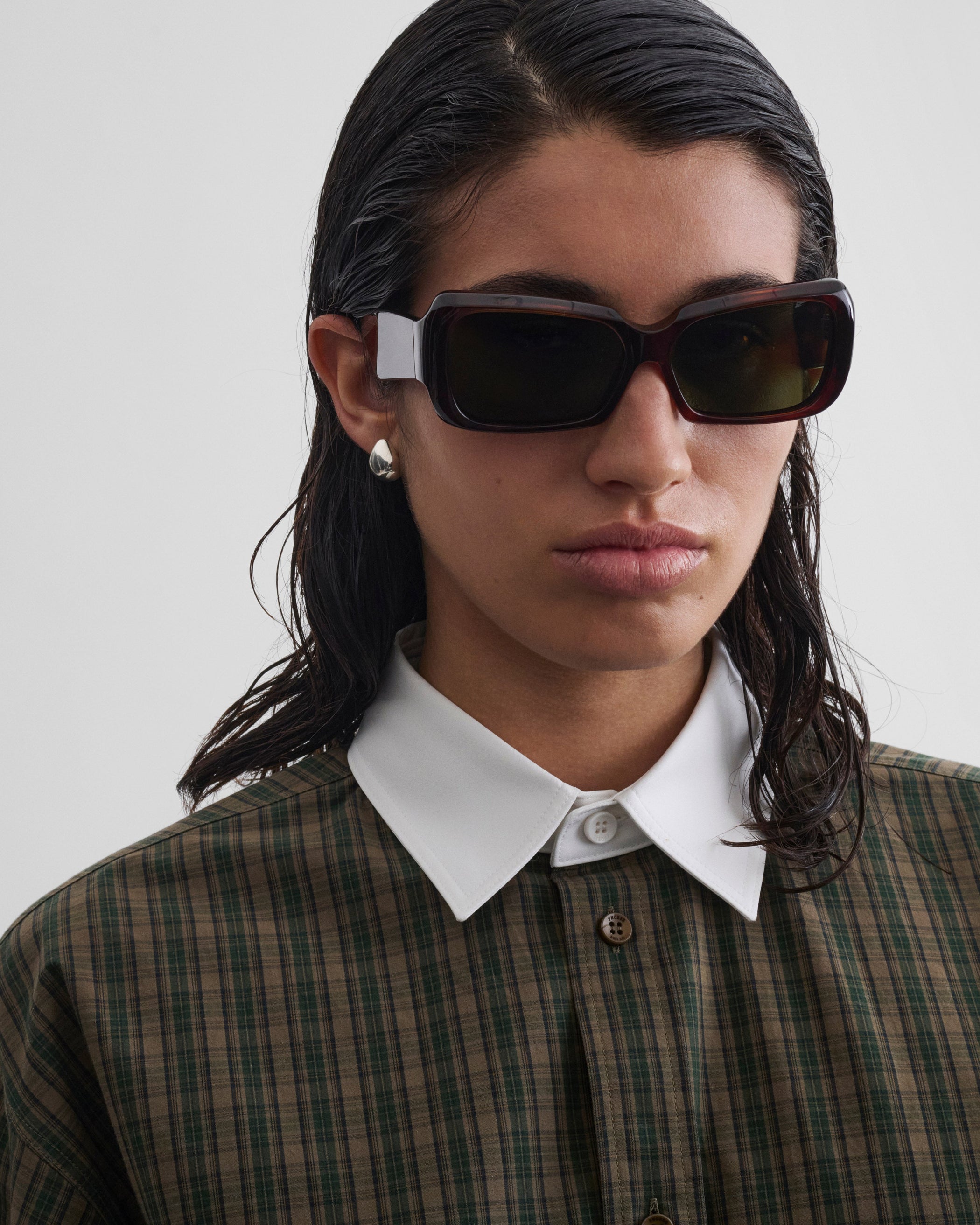 Front view of model wearing SCORE SUNGLASSES in brown tortoiseshell acetate