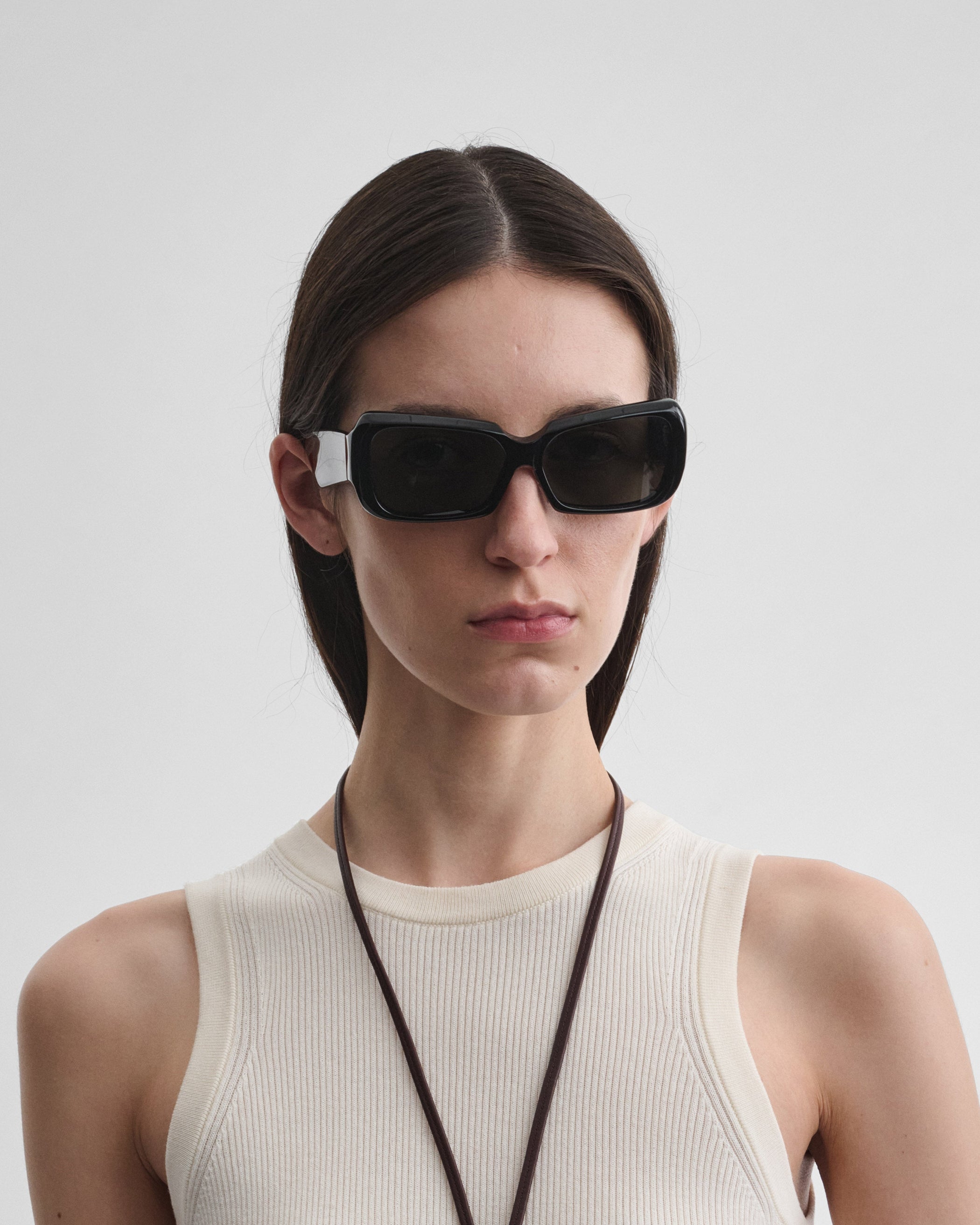 Front view of model wearing SCORE SUNGLASSES in black acetate