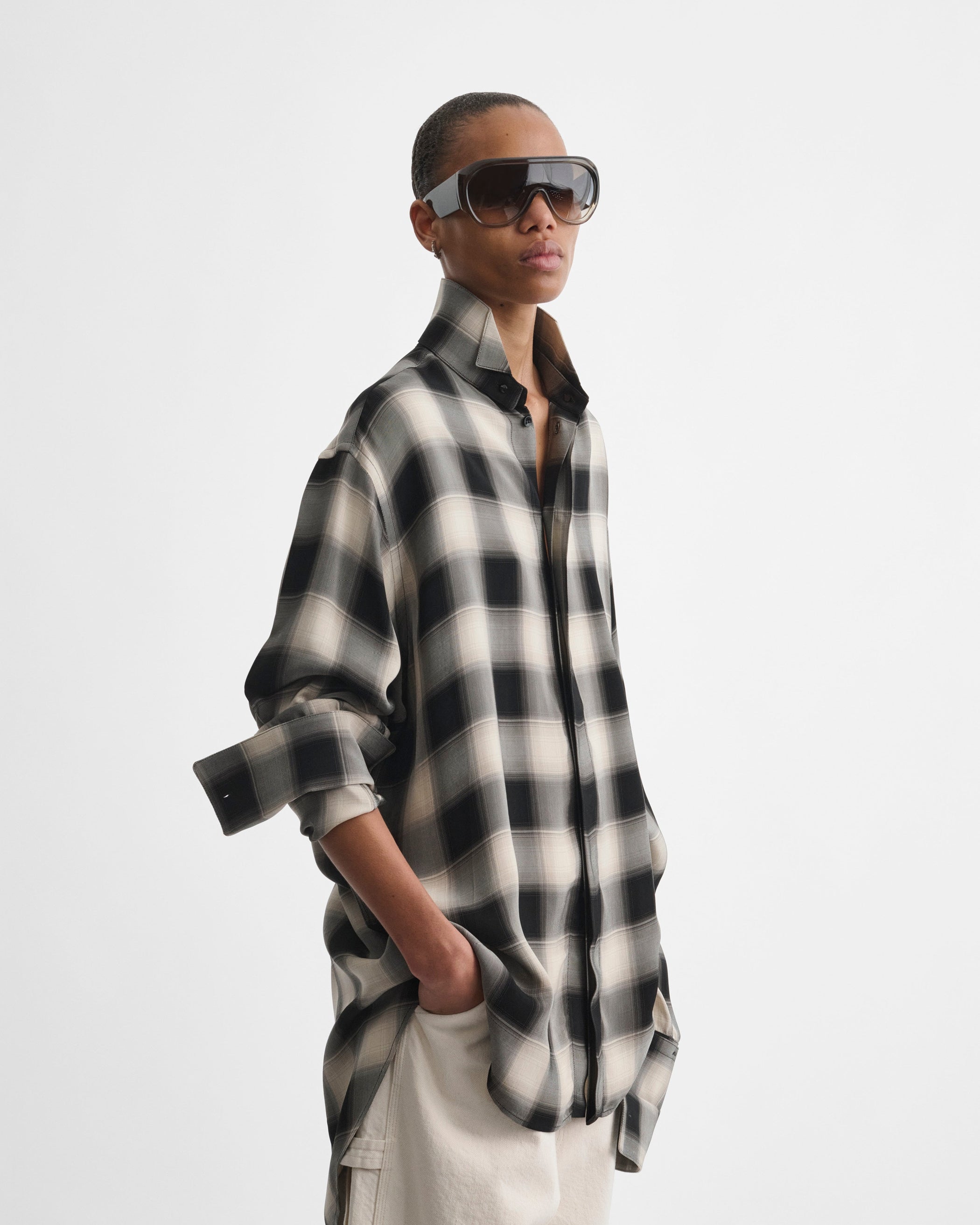 Front view of model wearing BOMBÉ SUNGLASSES in fume acetate