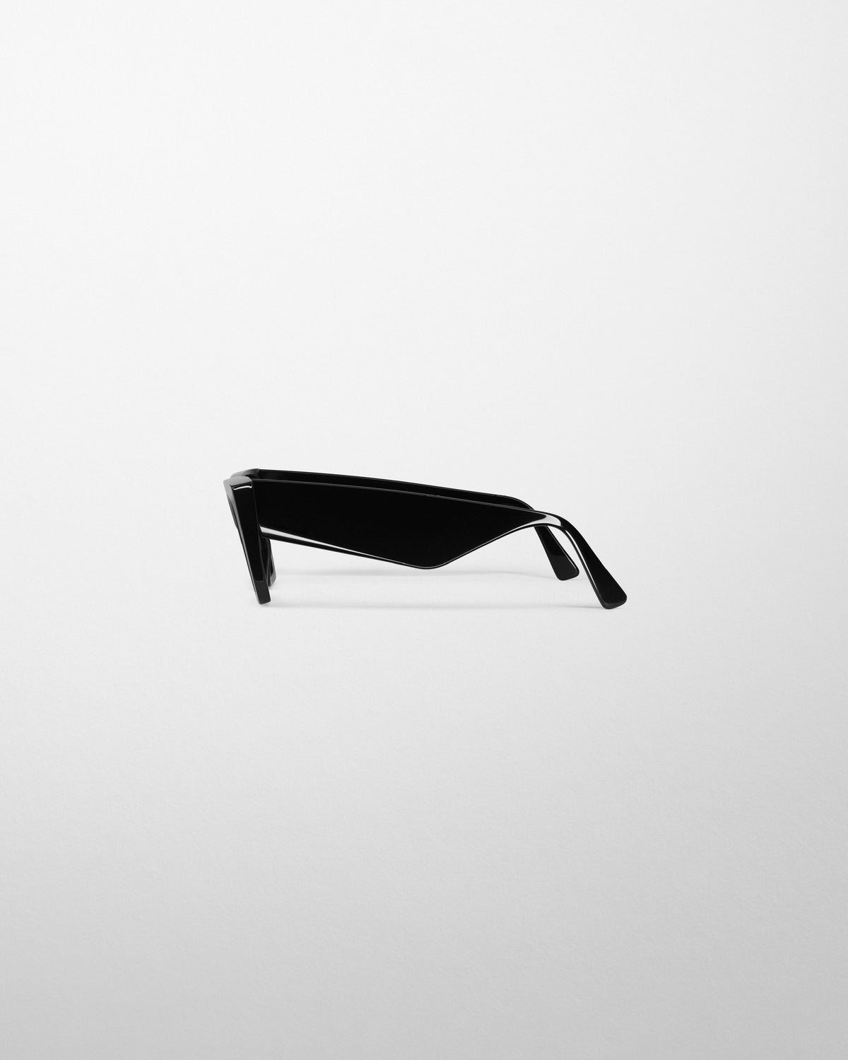 Flat side view of PEAK SUNGLASSES in black acetate