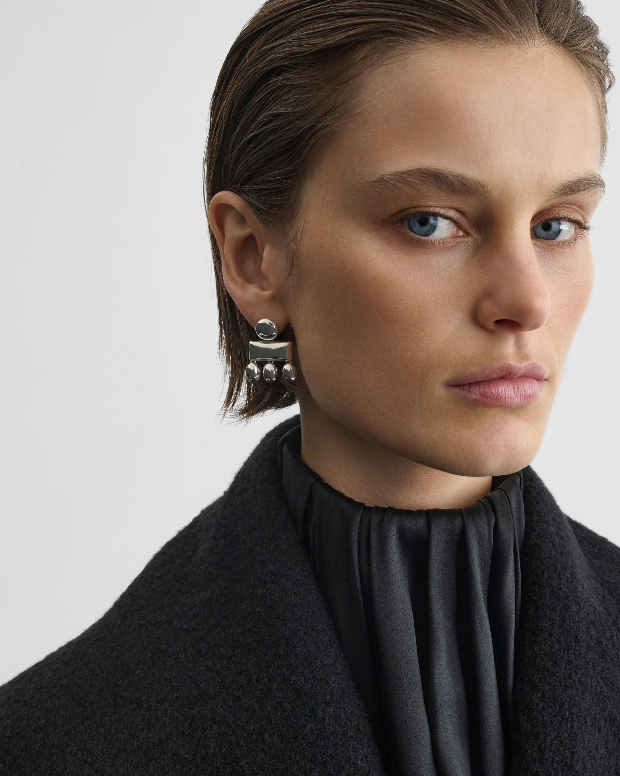 Front view of model wearing MINI CHANDELIER EARRINGS in sterling silver