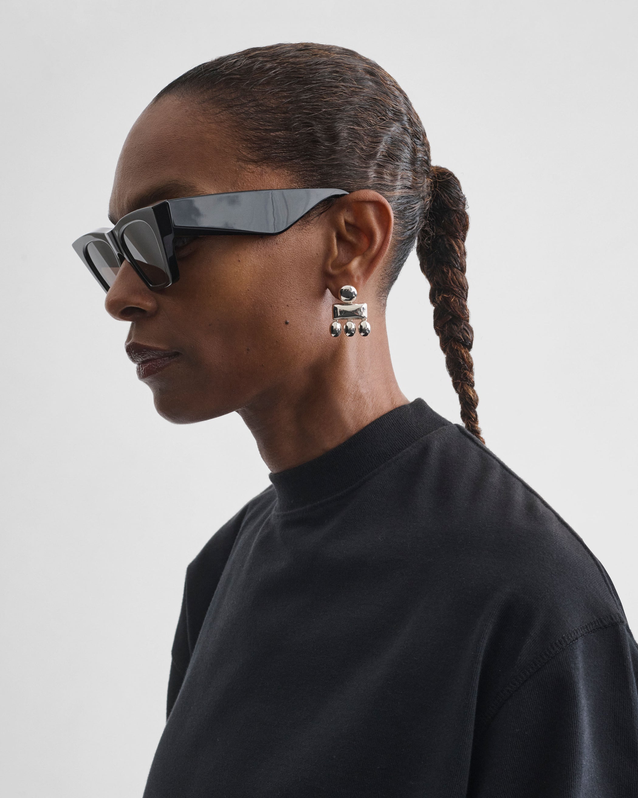 Model wearing MINI CHANDELIER EARRINGS in sterling silver