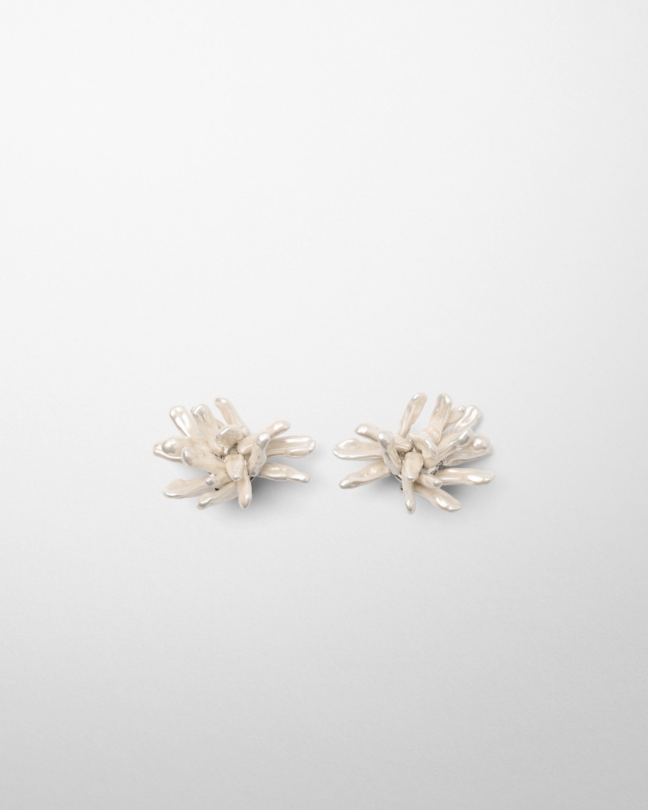 Front view of CLUSTER EARRINGS in silver cream resin