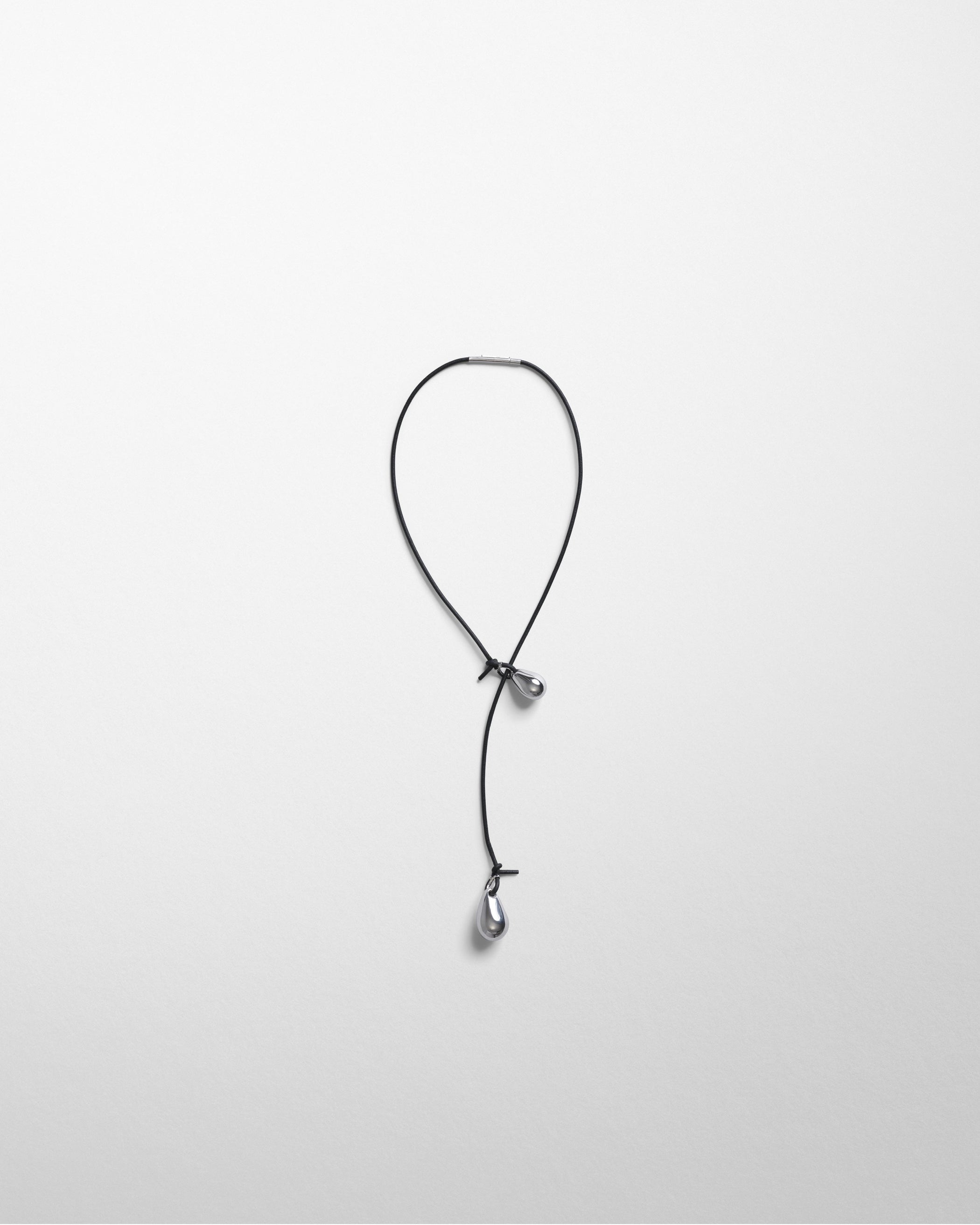 Flat front view of PEBBLE DUO PENDANT in sterling silver