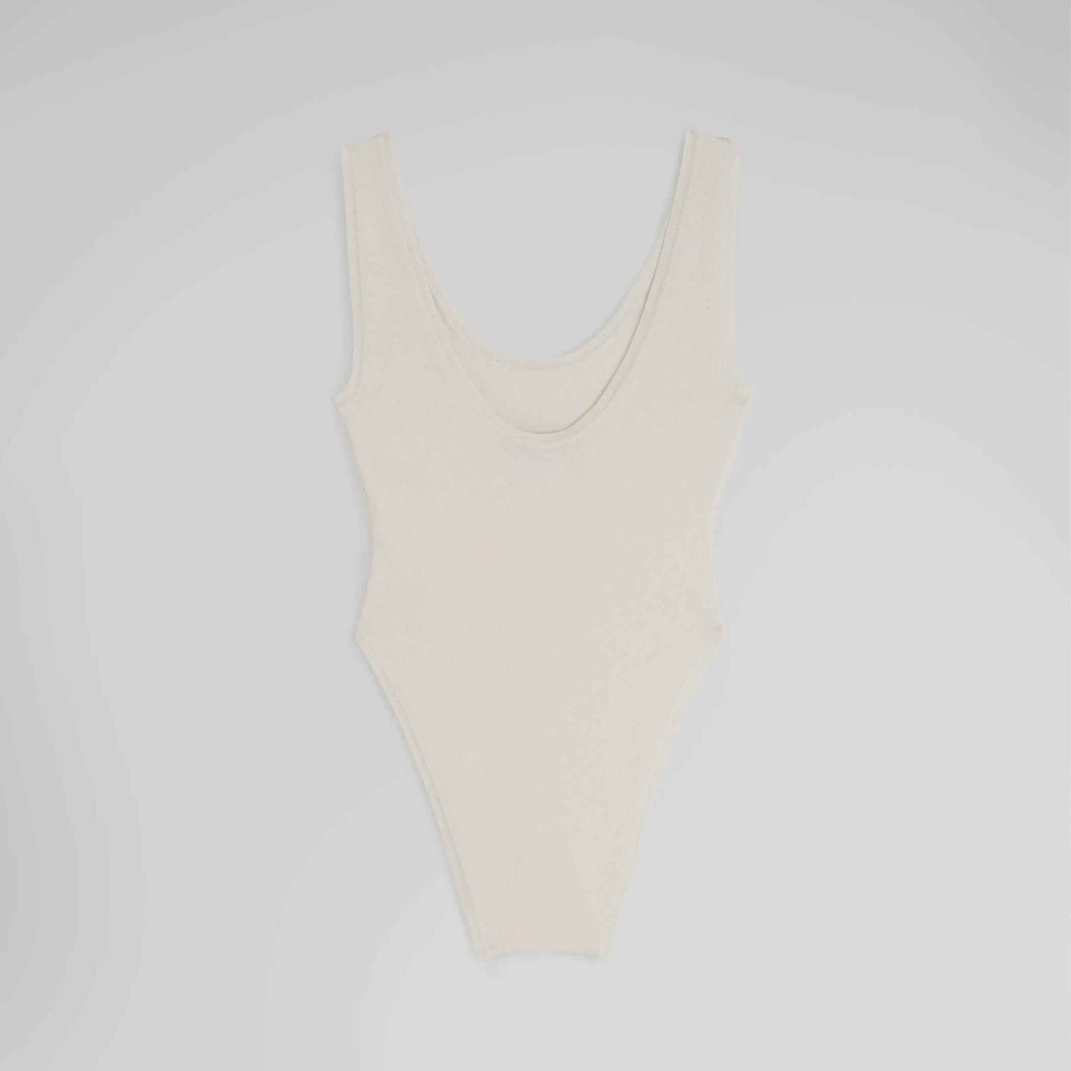 Flat back shot of BODY in off white silk