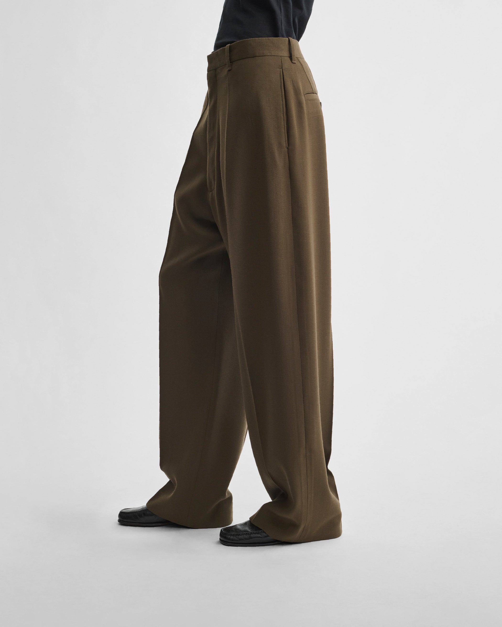Side view of model wearing DROP TROUSERS in shroom wool