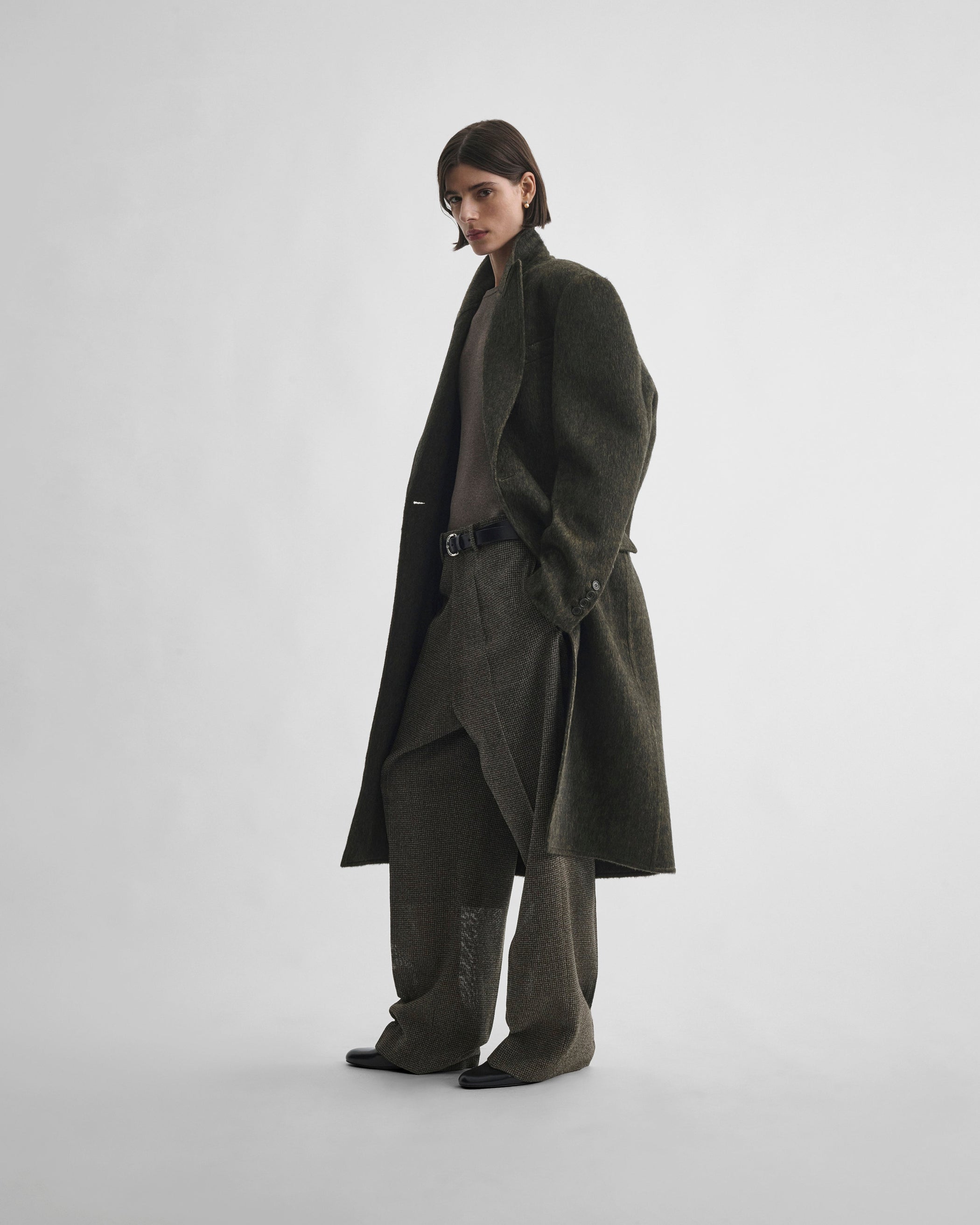 Front view of model wearing DROP TROUSERS in khaki/white wool
