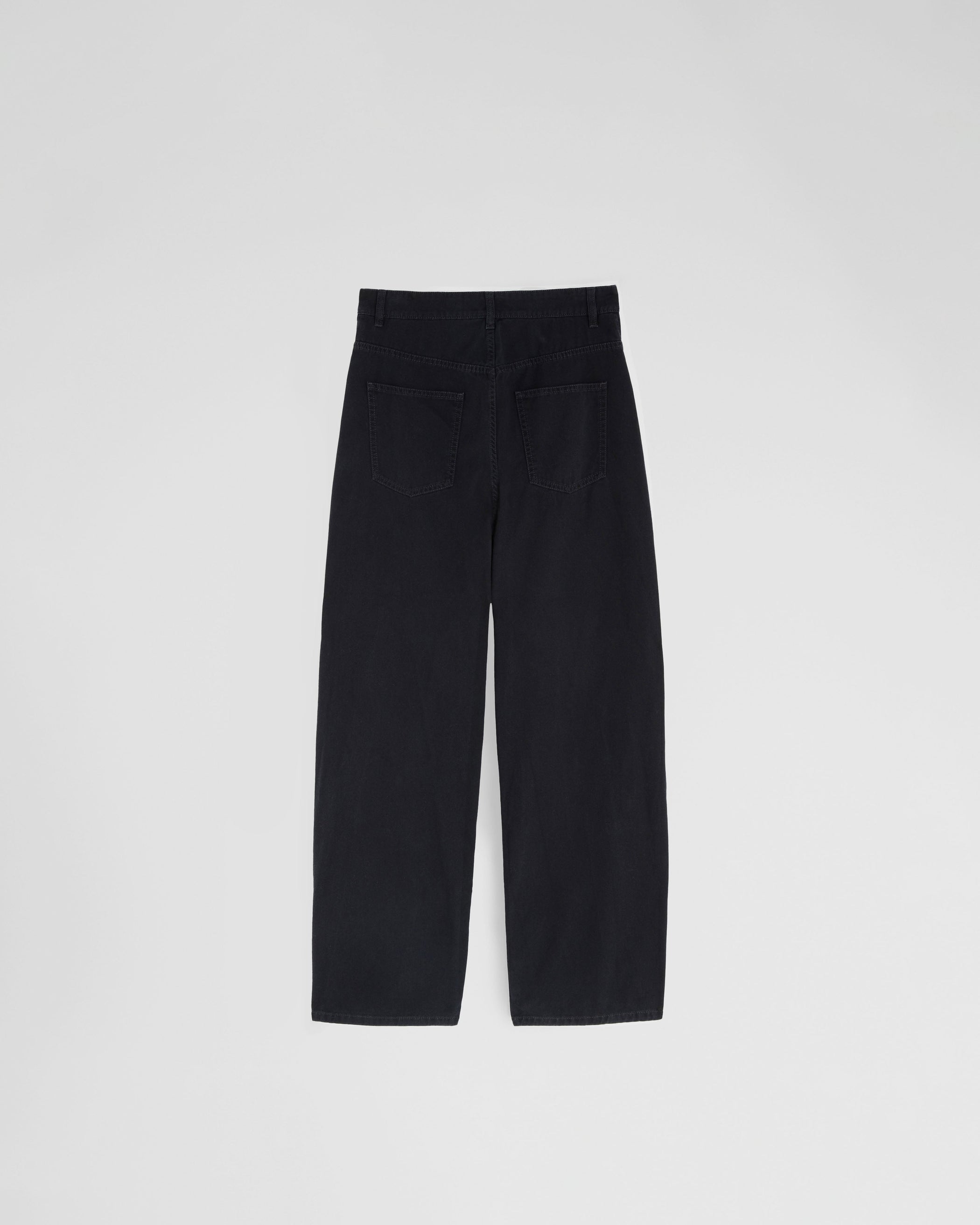 Flat back view of DROP JEANS in black cotton