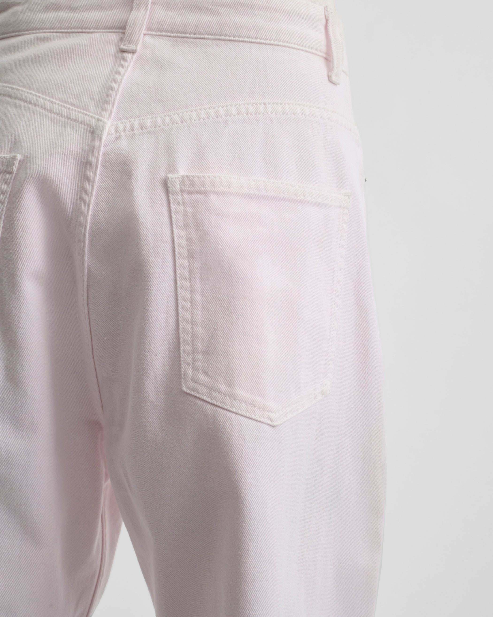 Pocket detail view of model wearing DROP JEANS in pale pink pink