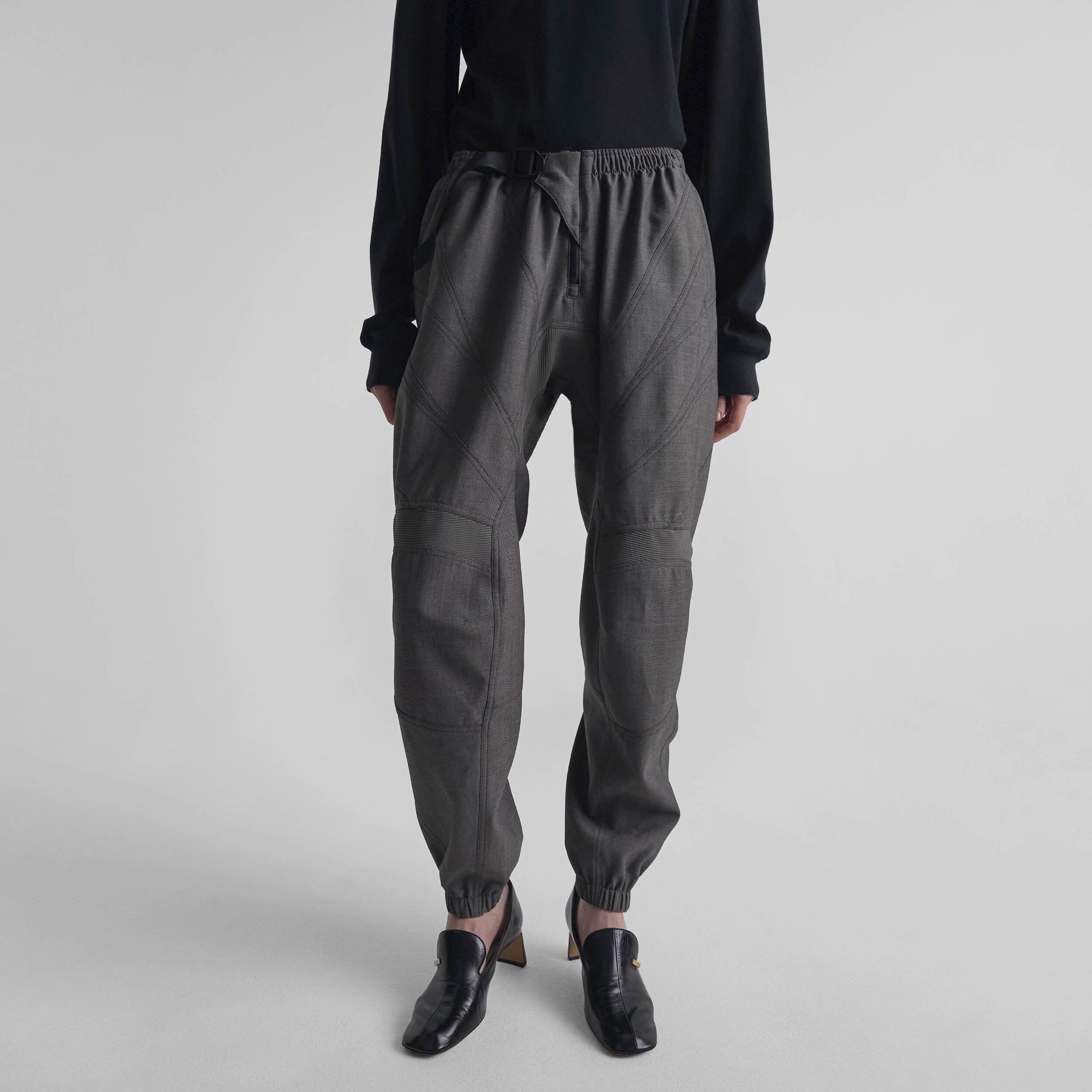 Front view of model wearing BMX TROUSERS in dark taupe wool