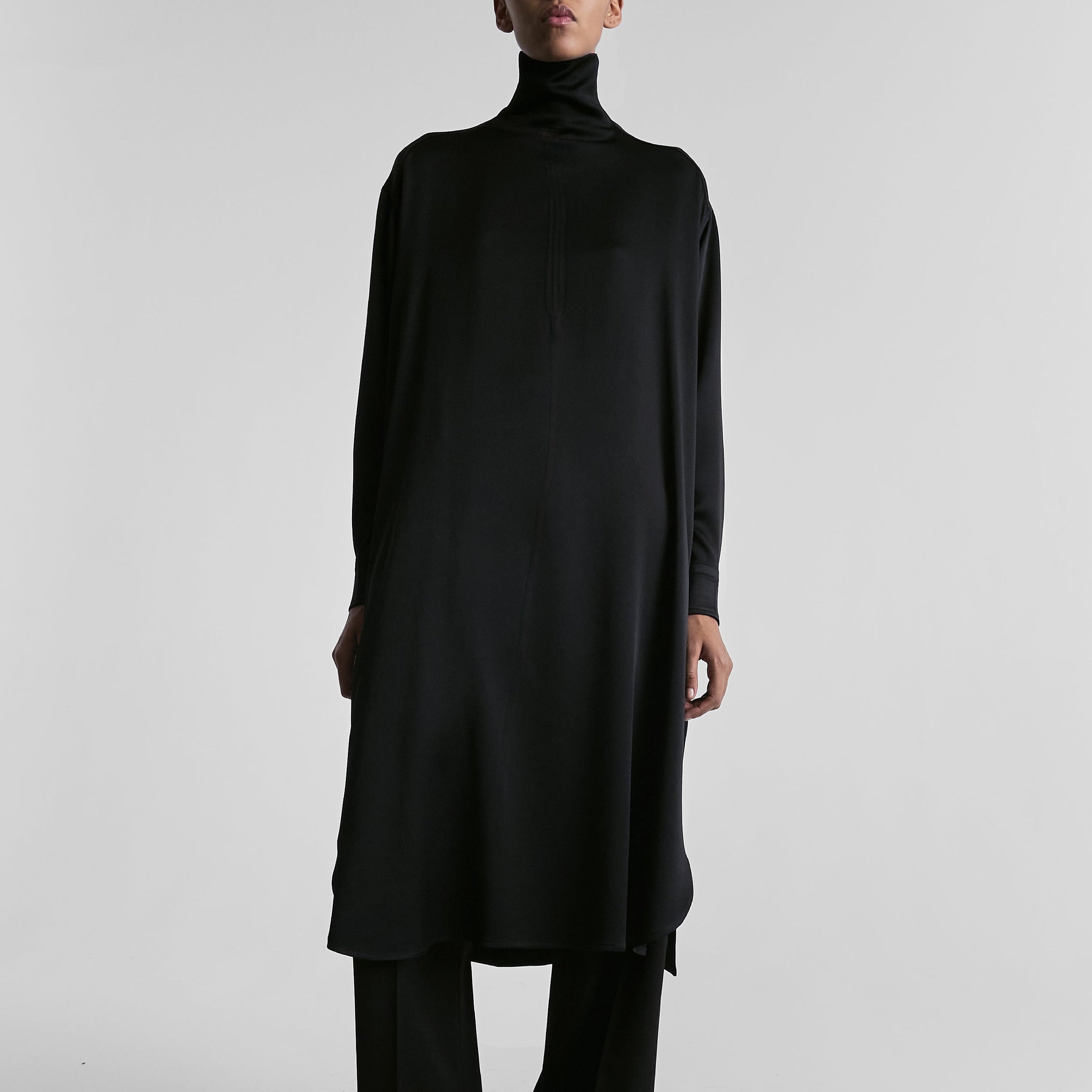 Front view of model wearing DRESS in black satin back crepe