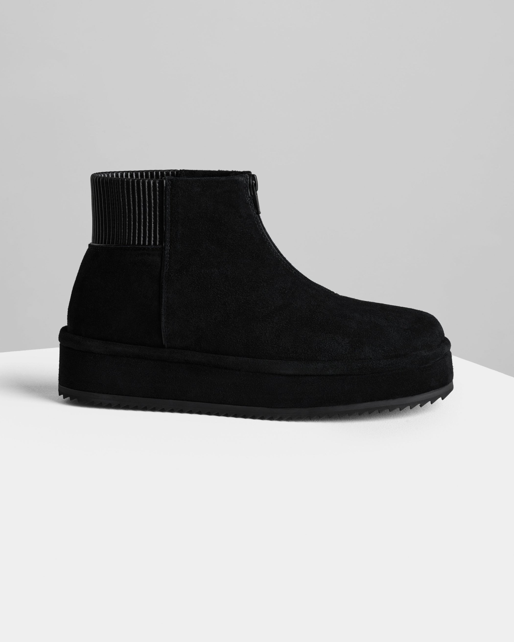 Side view of Bumper Bootie in black leather