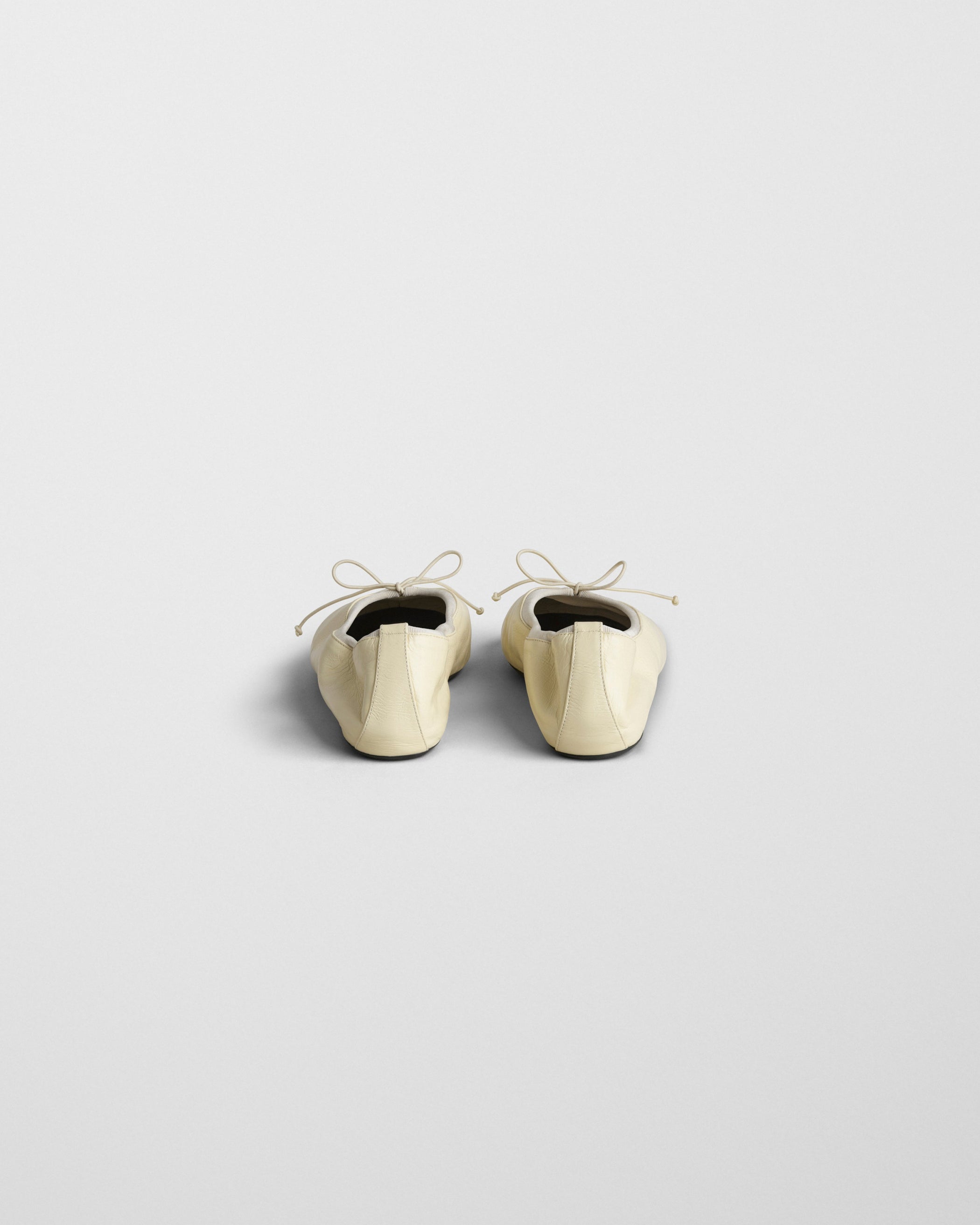 Back view of GATHERED FLAT in stucco leather