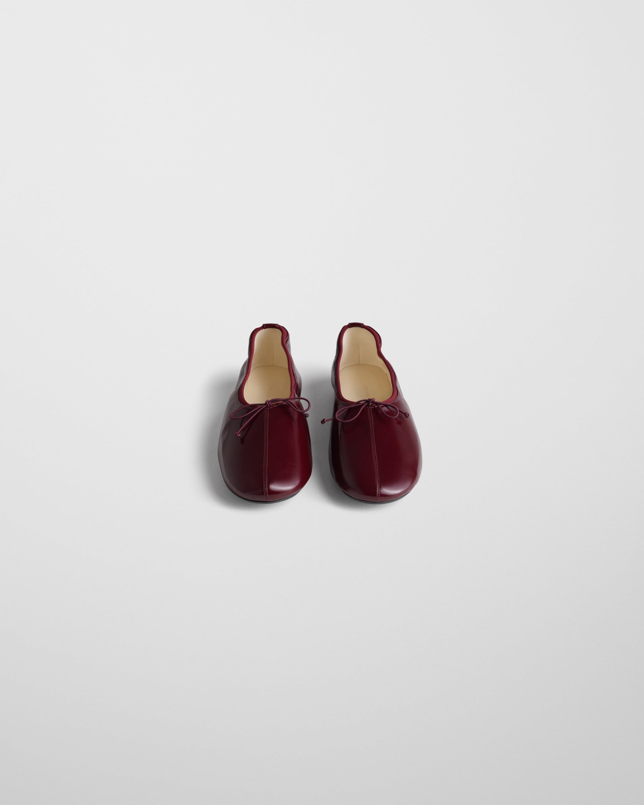 Front view of GATHERED FLAT in merlot leather