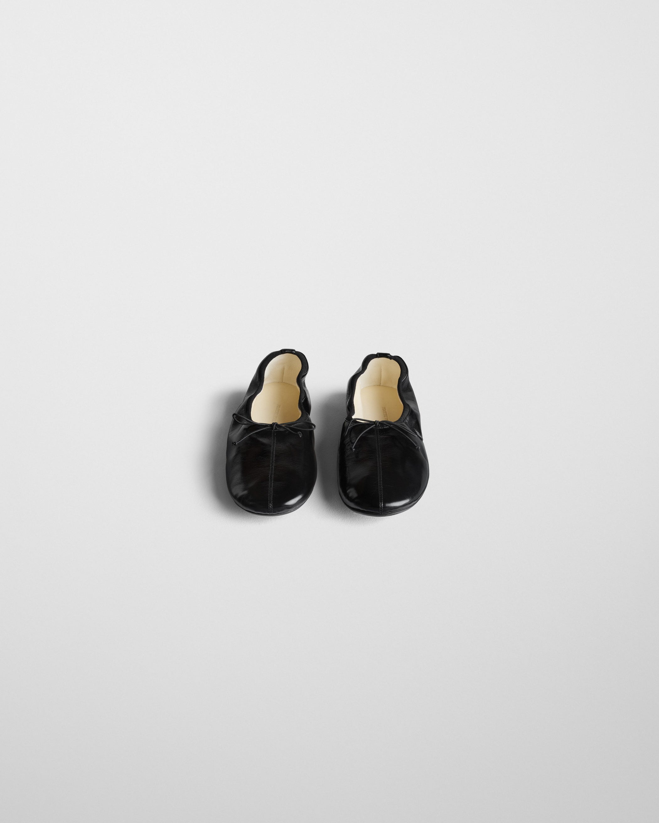 Front view of GATHERED FLAT in black leather