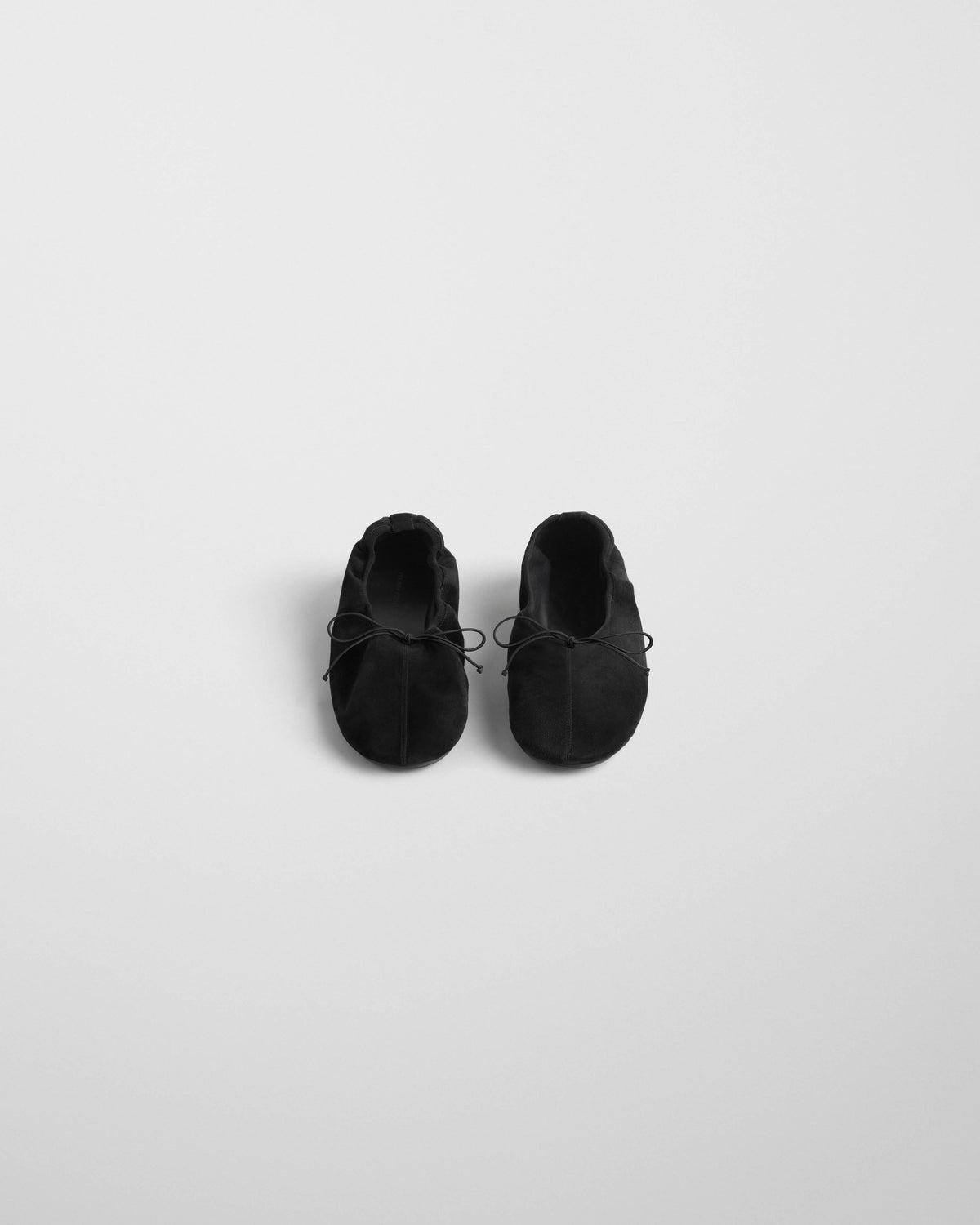 Front view of GATHERED FLAT in black suede