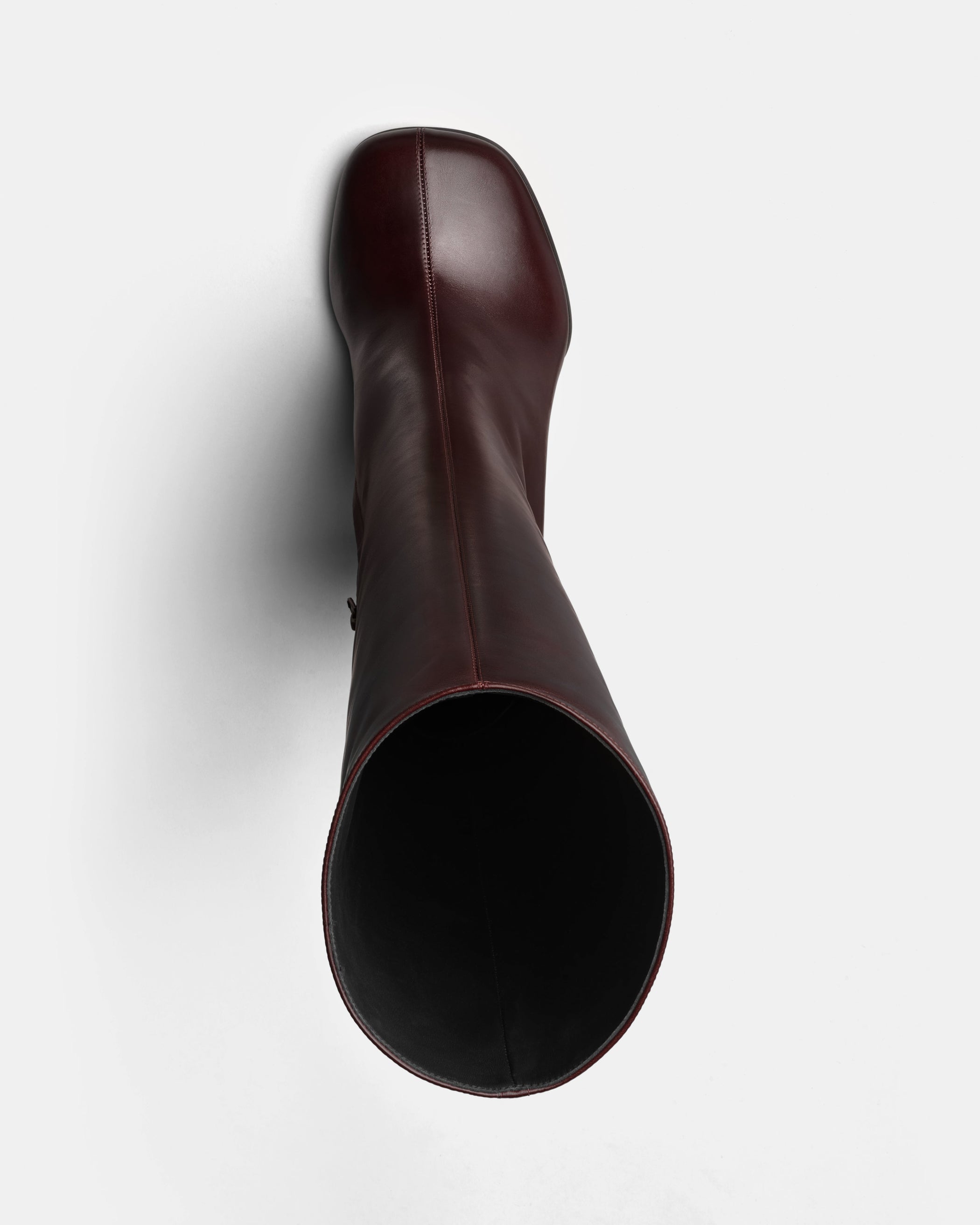 Flat front view of Knee-High Boot in oxblood leather