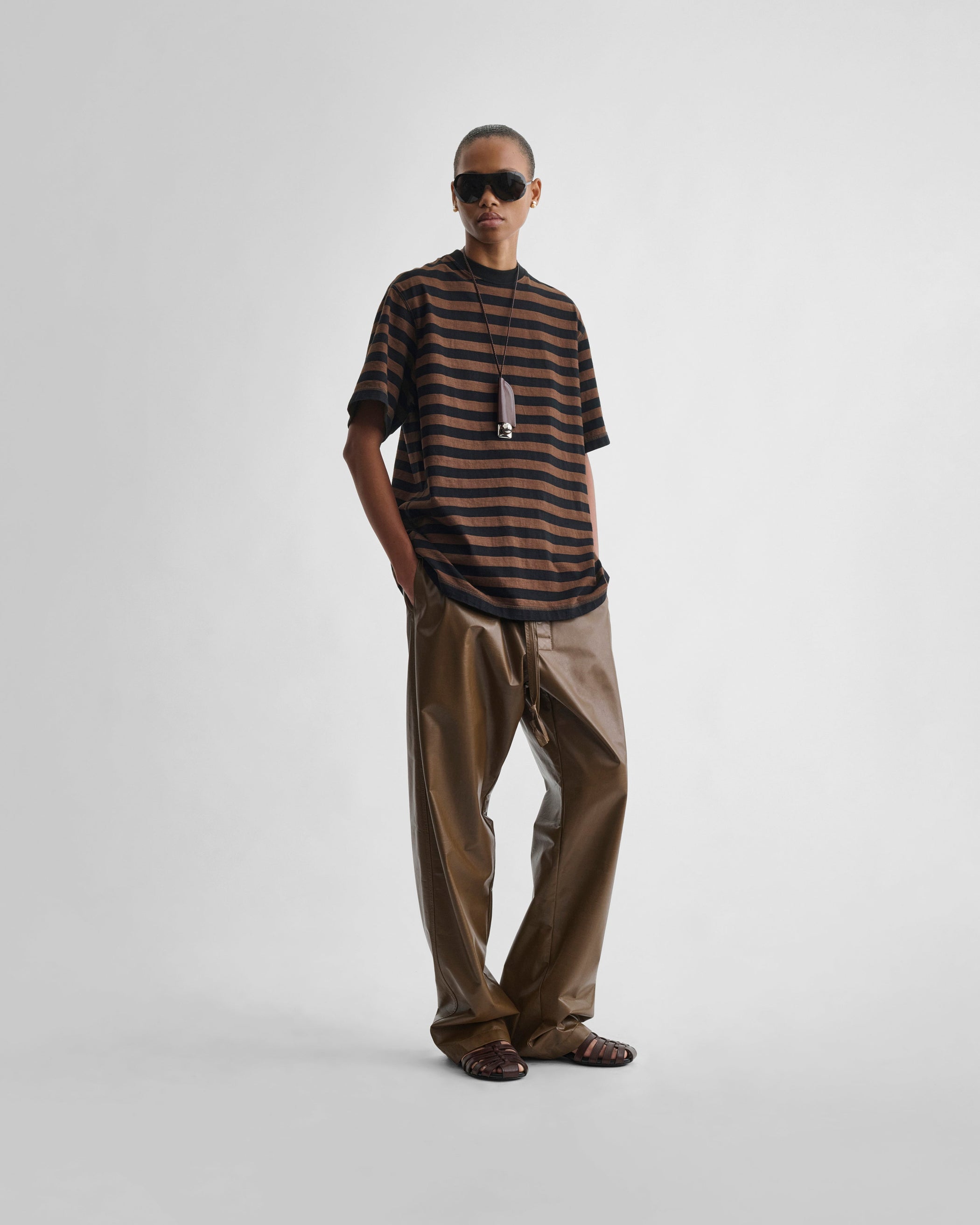 Front view of model wearing CLASSIC TEE in black/brown cotton