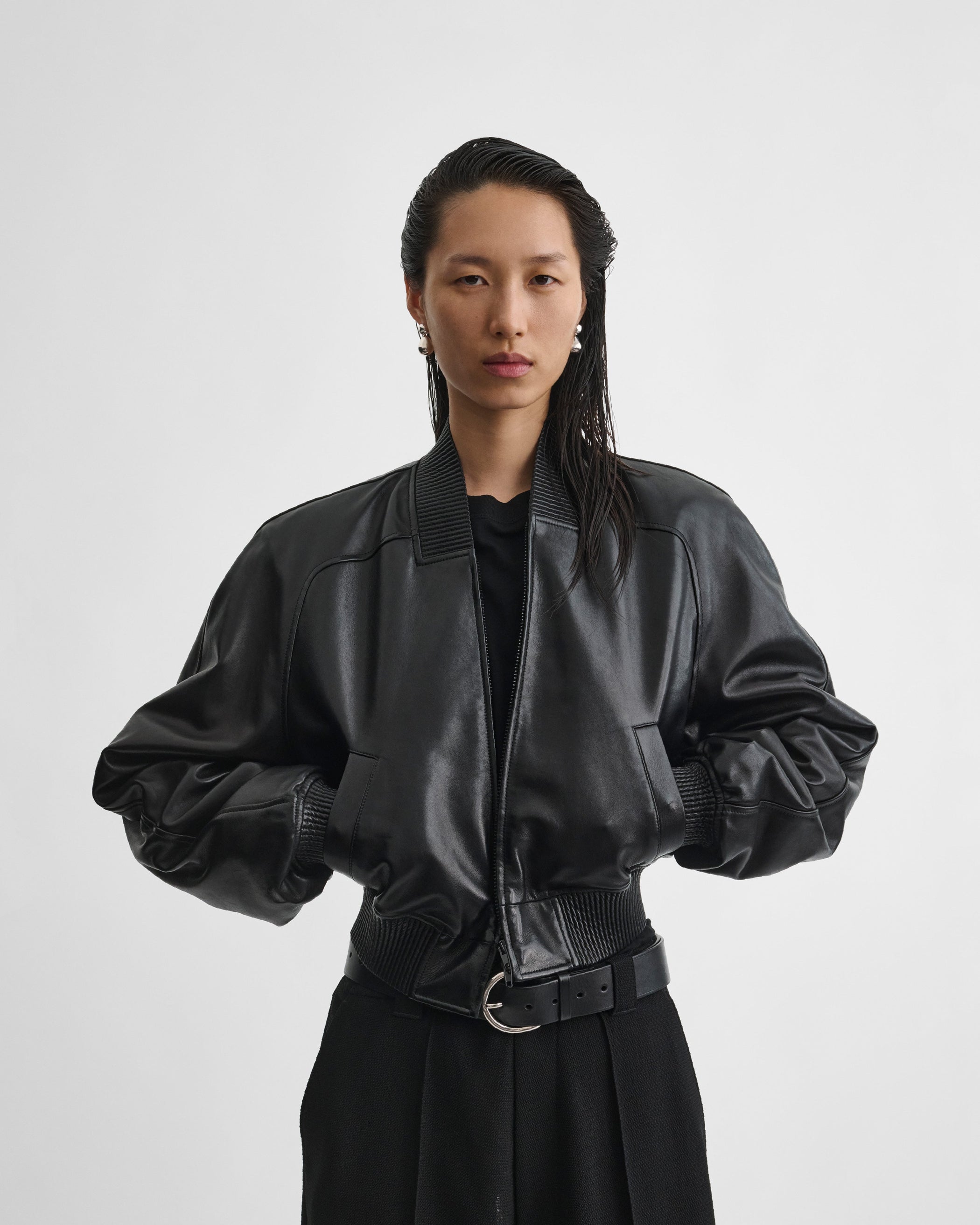 Front view of model wearing SHRUNK BOMBER in black leather