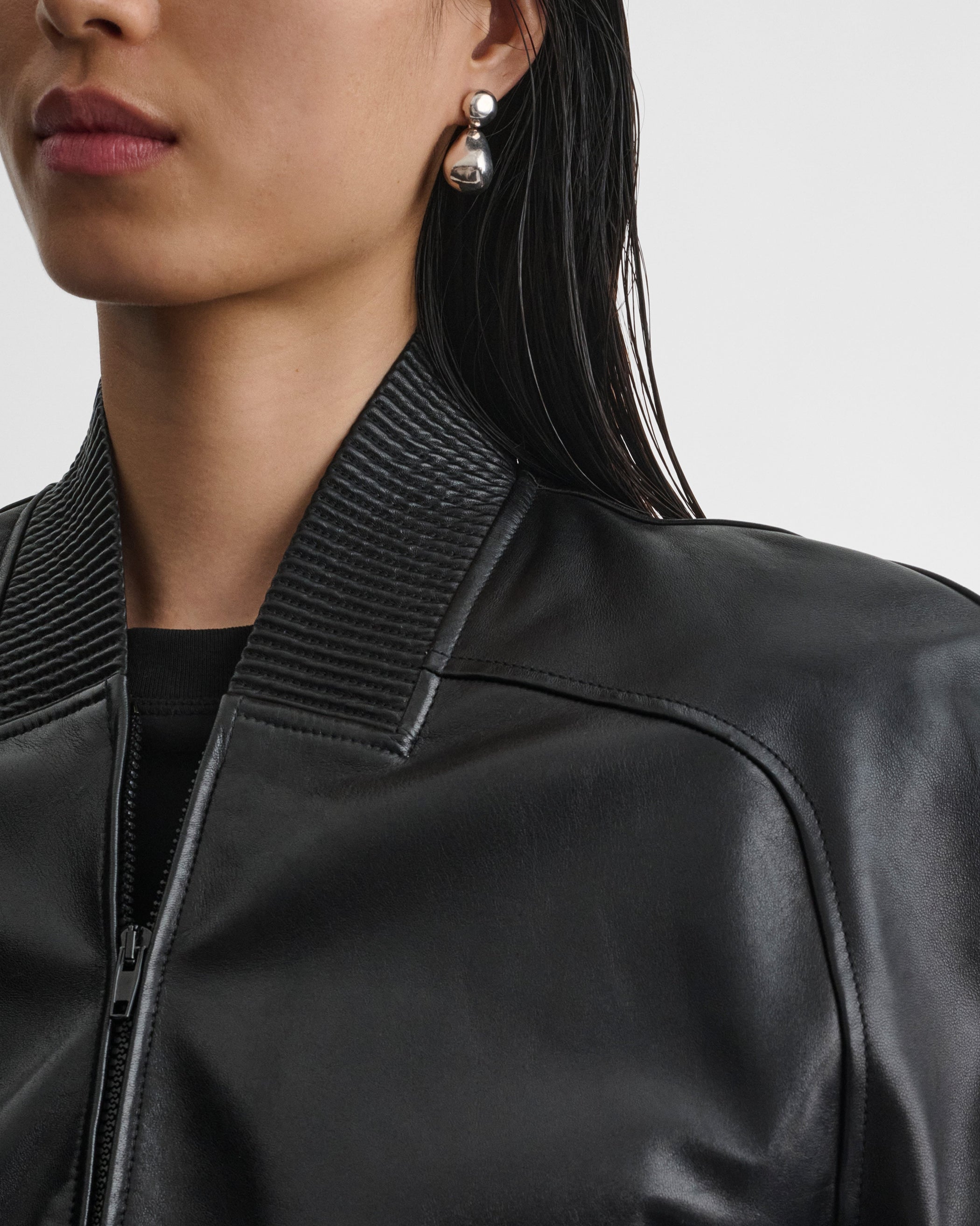 Front detail view of model wearing SHRUNK BOMBER in black leather