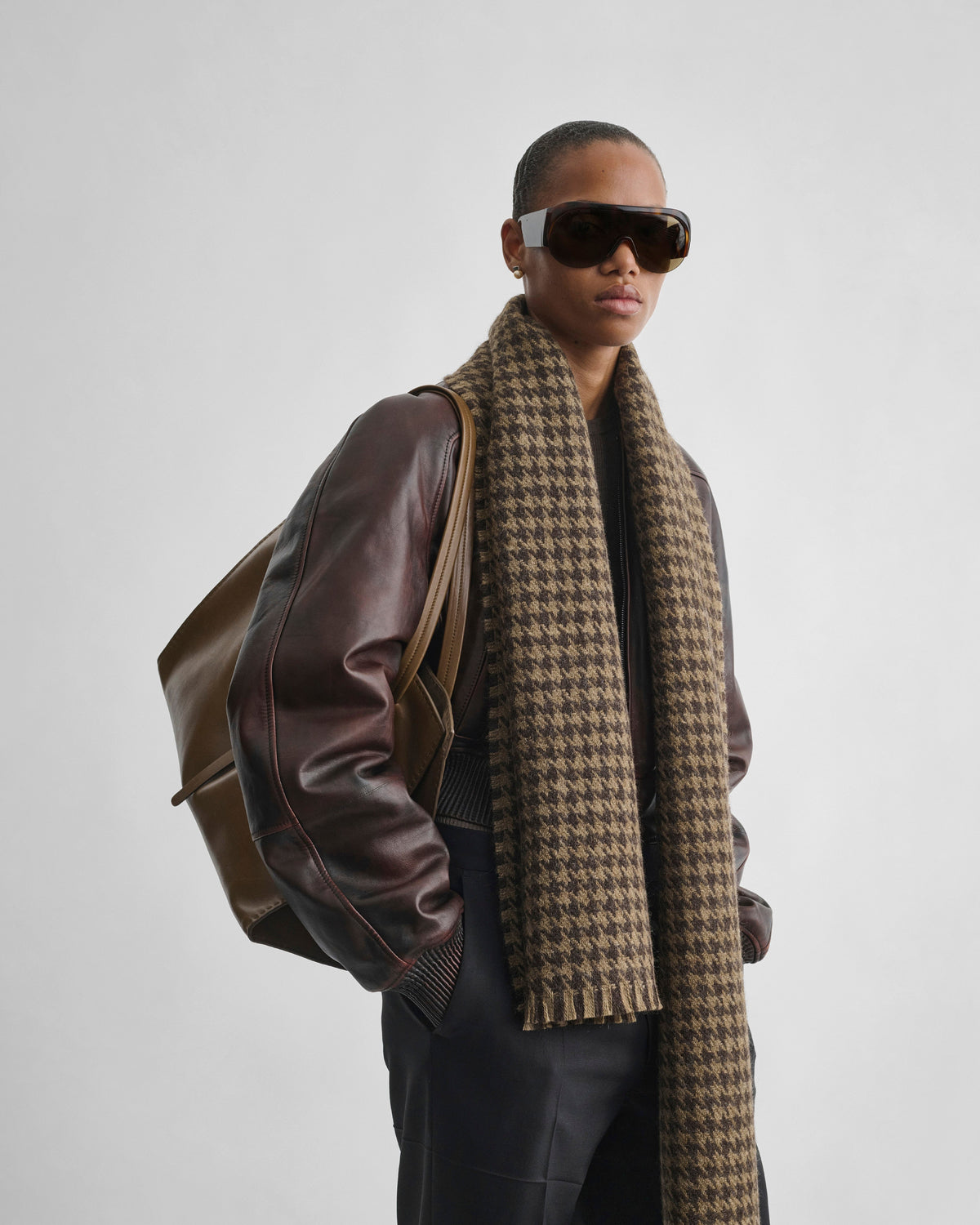 Front view of model wearing SHRUNK BOMBER in conker leather