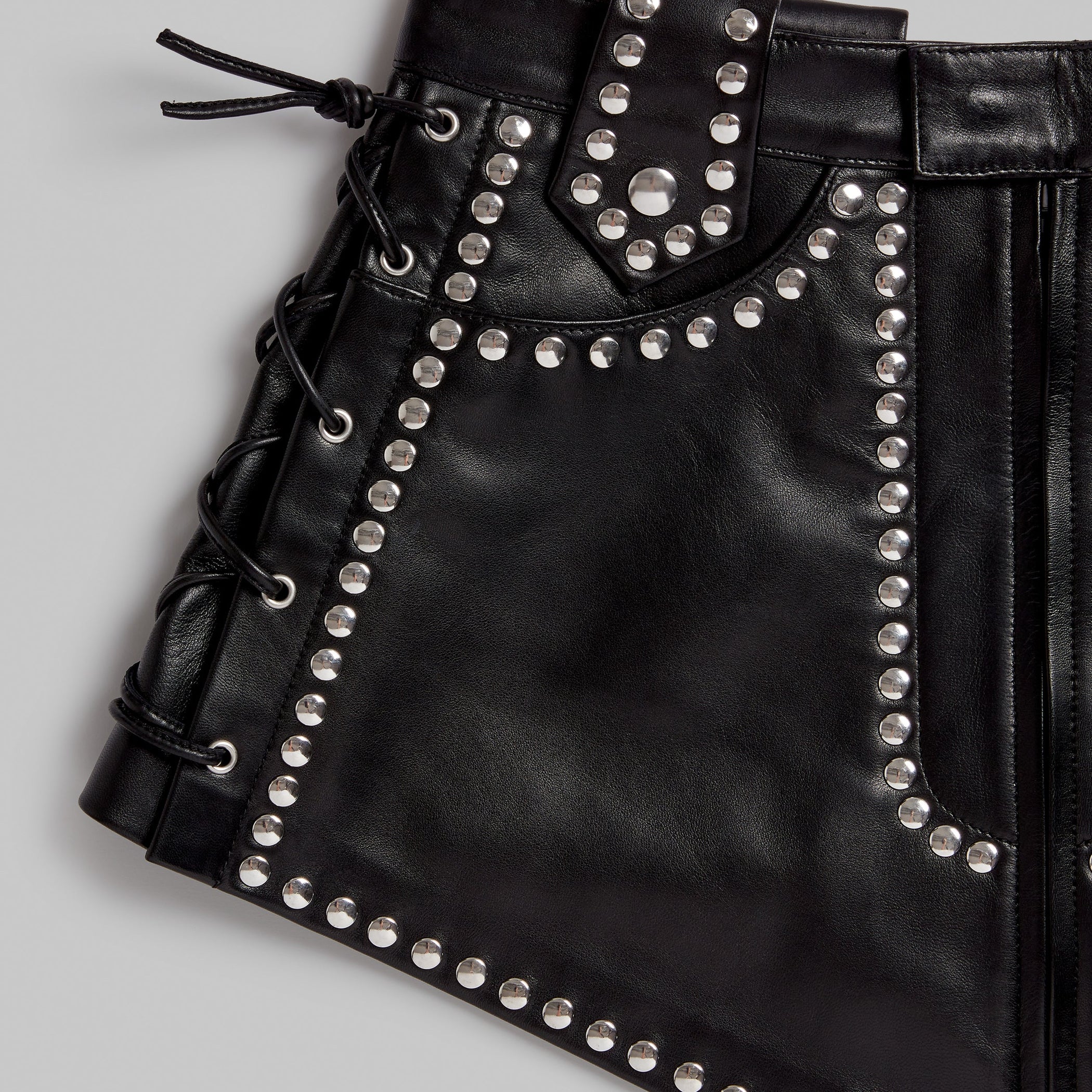 Close up detail view of STUDDED BELT in black leather