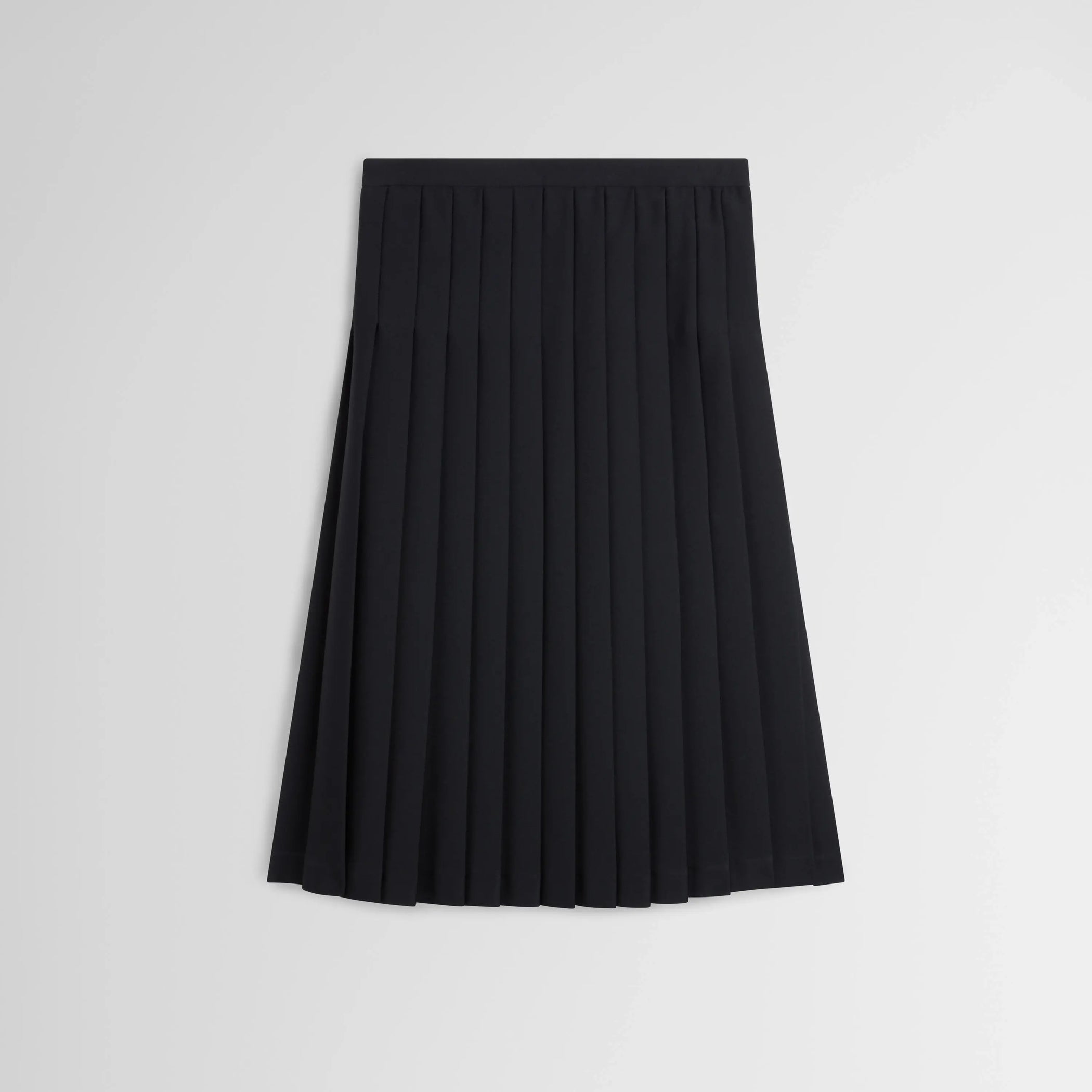 Flat front view of UNIFORM PLEATED SKIRT in black wool blend