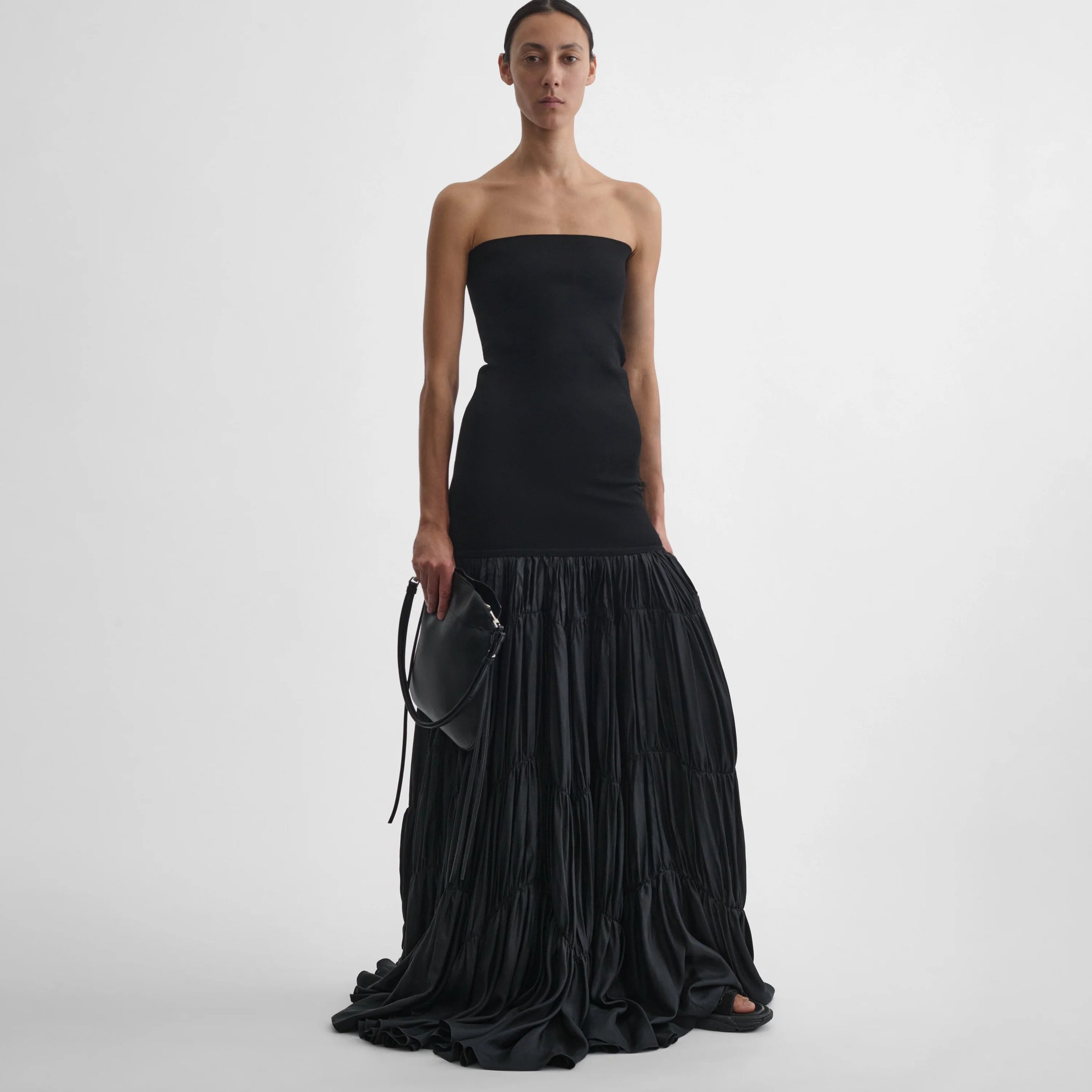 Front view of model wearing the parachute skirt in black